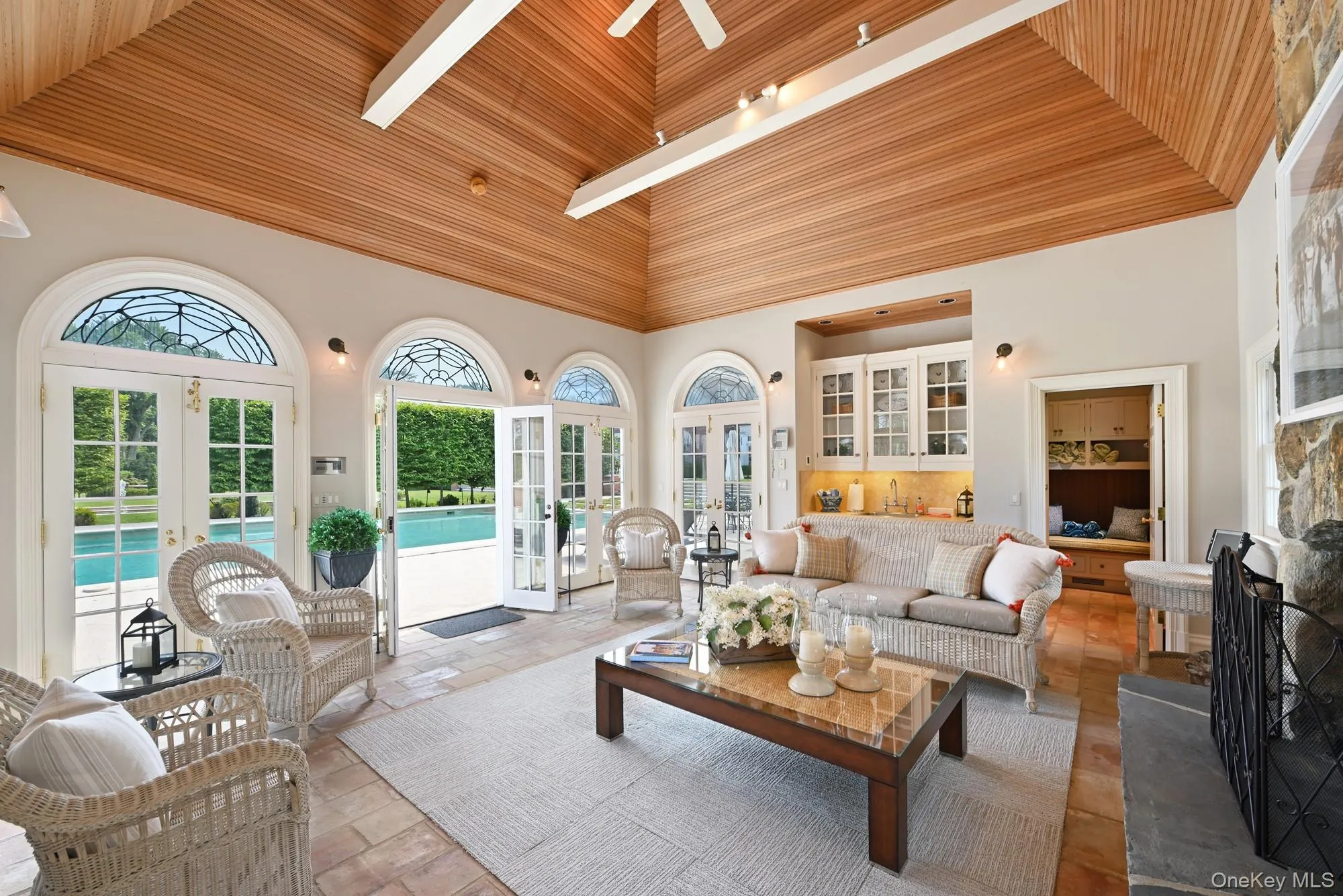 Sunroom / solarium featuring french doors and vaulted ceiling Sunroom / solarium featuring french doors and vaulted ceiling