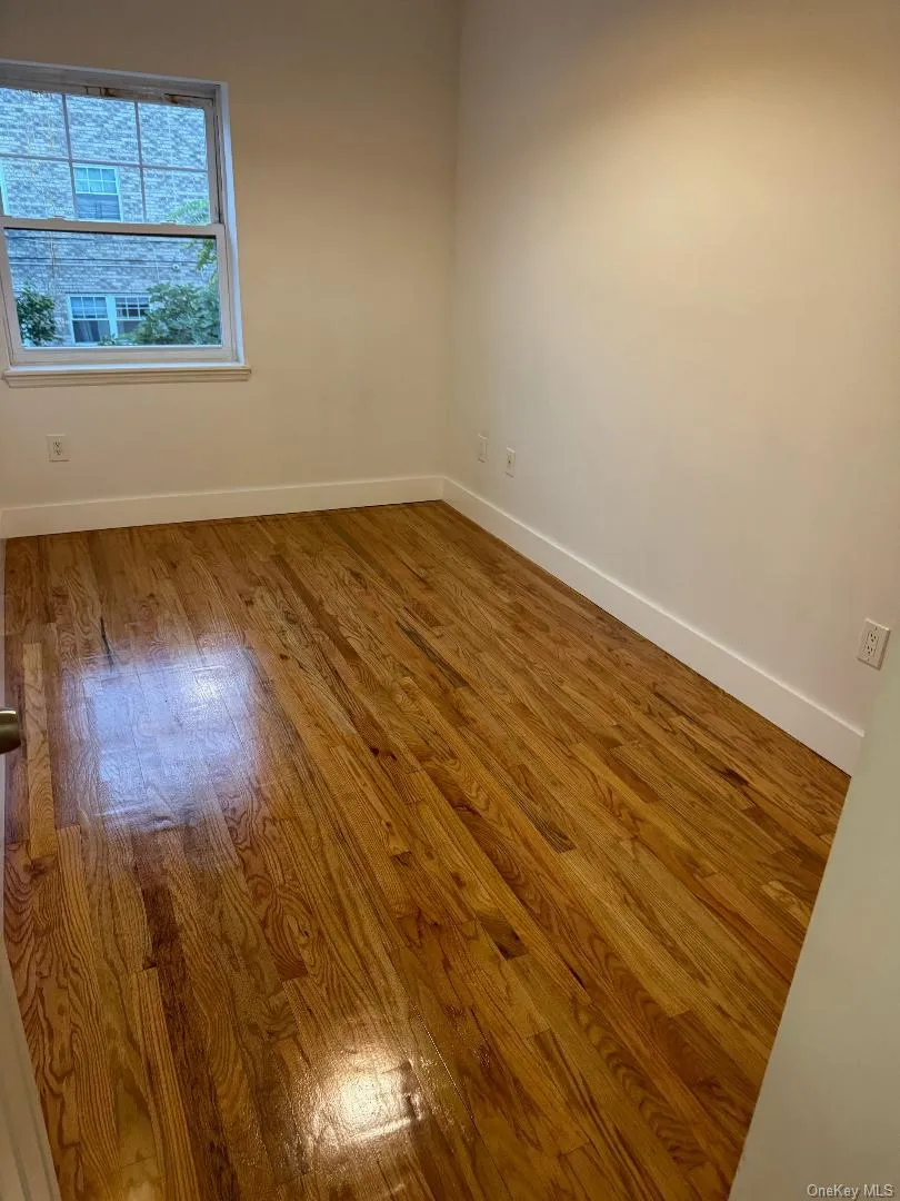Empty room with hardwood / wood-style floors Empty room with hardwood / wood-style floors