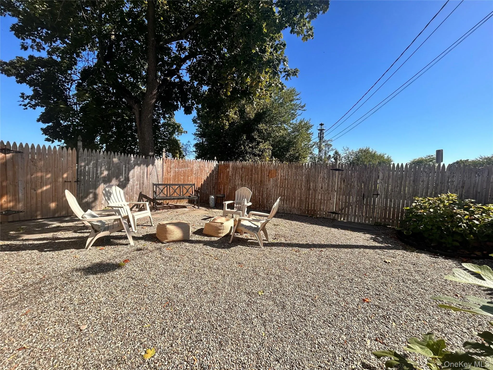 Fenced backyard featuring a patio and a fire pit Fenced backyard featuring a patio and a fire pit