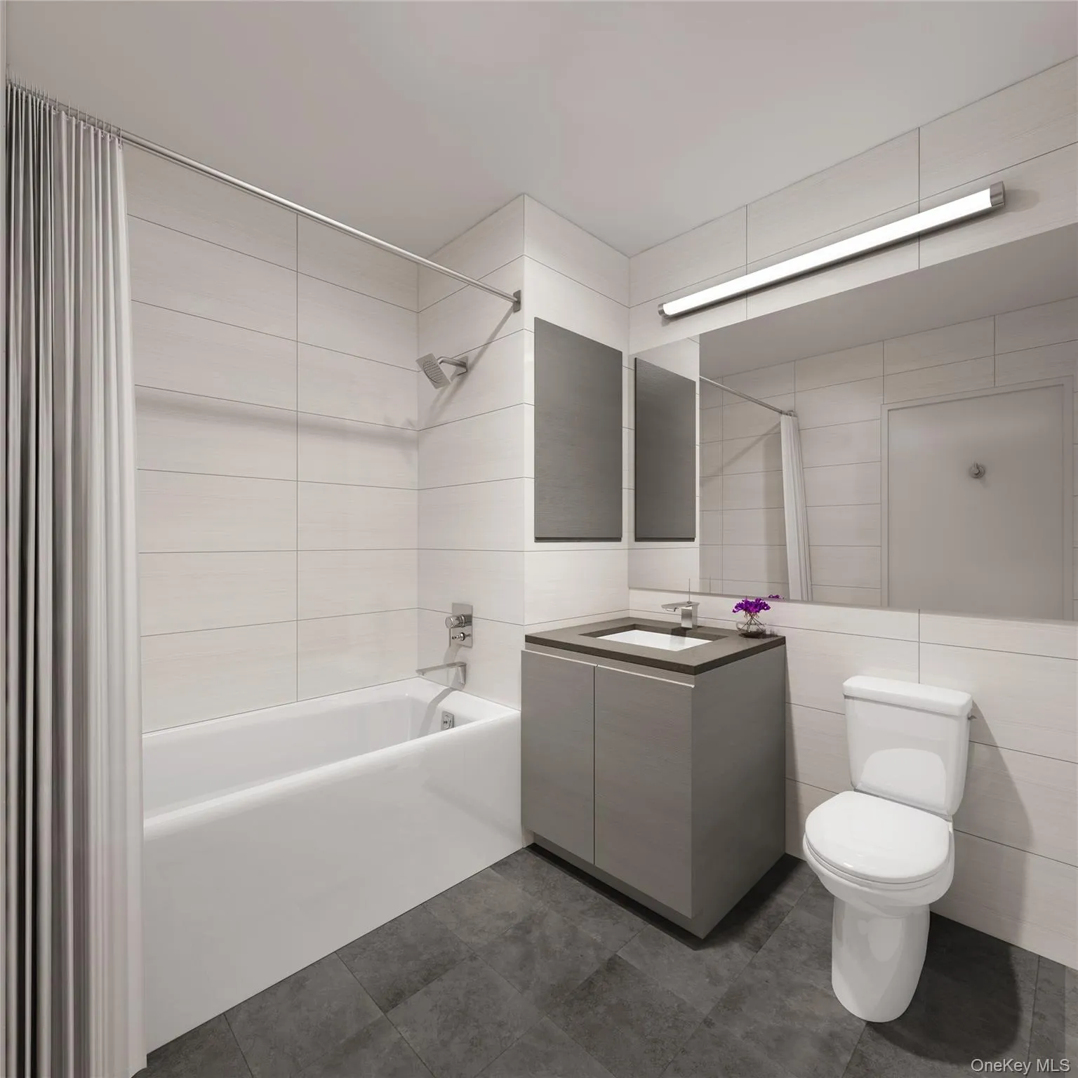 Full bathroom featuring tub / shower combination, vanity, tile walls, and dark tile patterned flooring Full bathroom featuring tub / shower combination, vanity, tile walls, and dark tile patterned flooring