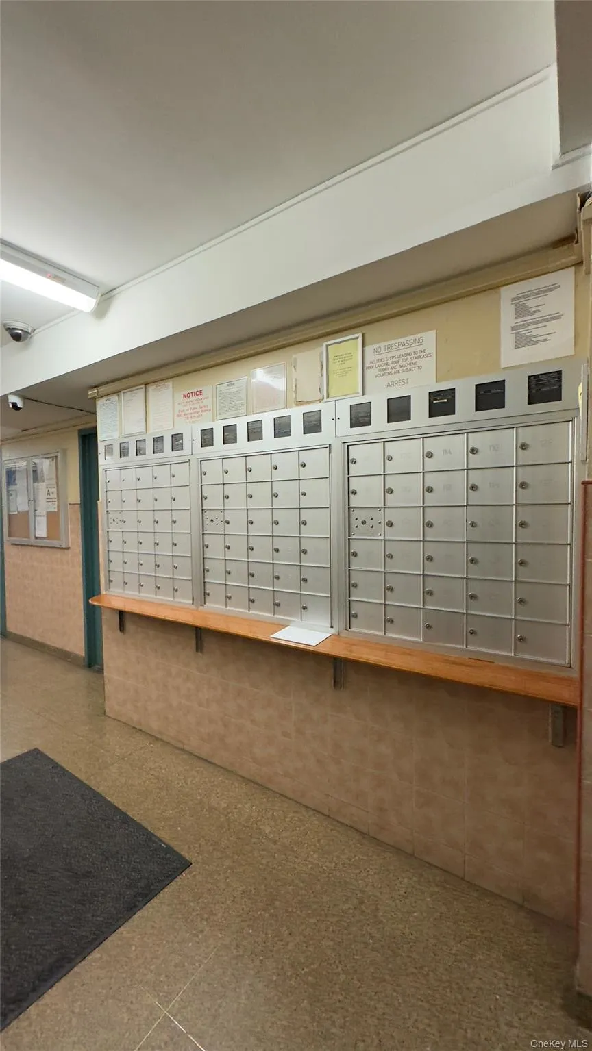 View of property's community with mail area and a balcony View of property's community with mail area and a balcony
