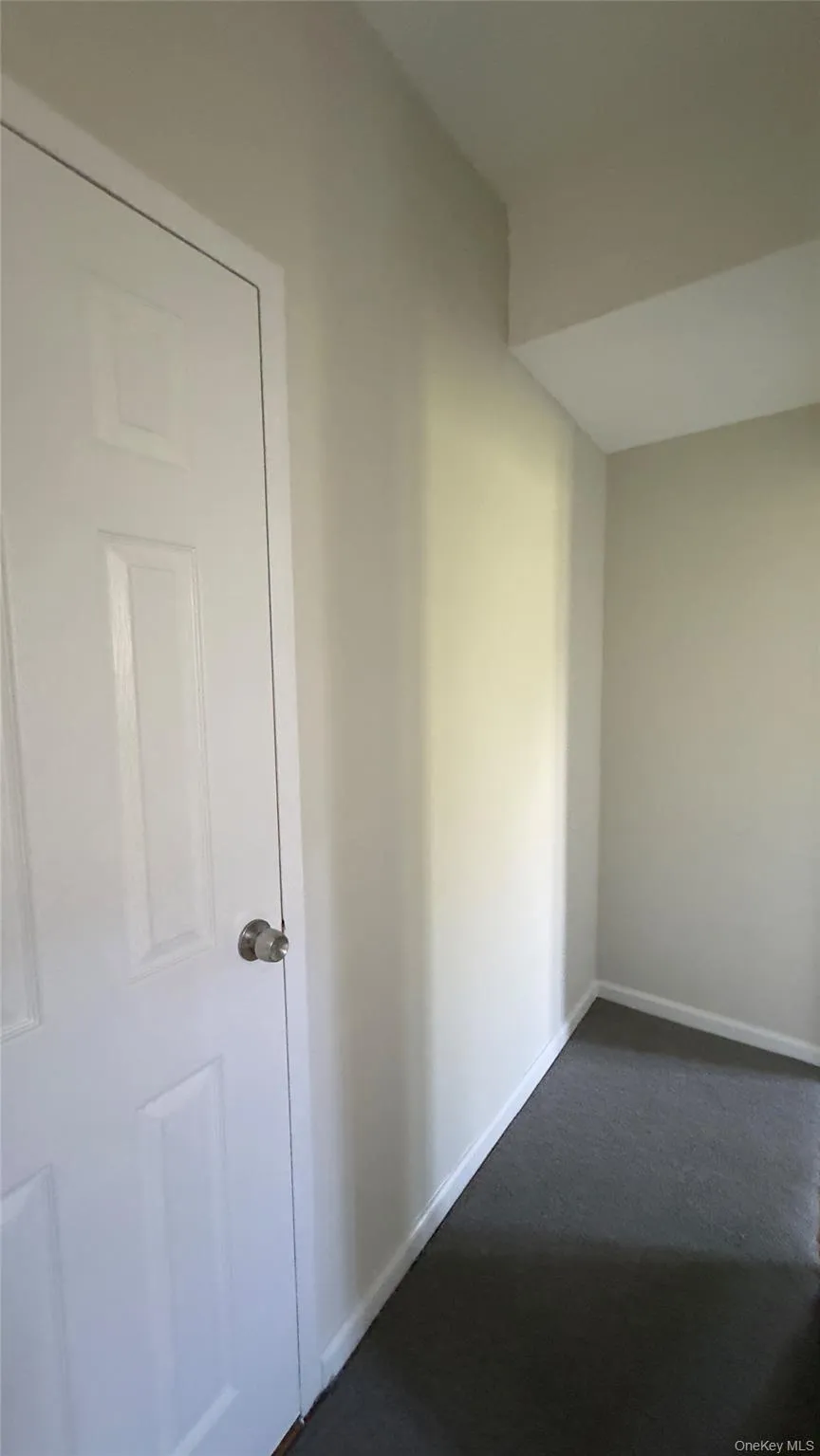 Spare room with dark carpet Spare room with dark carpet