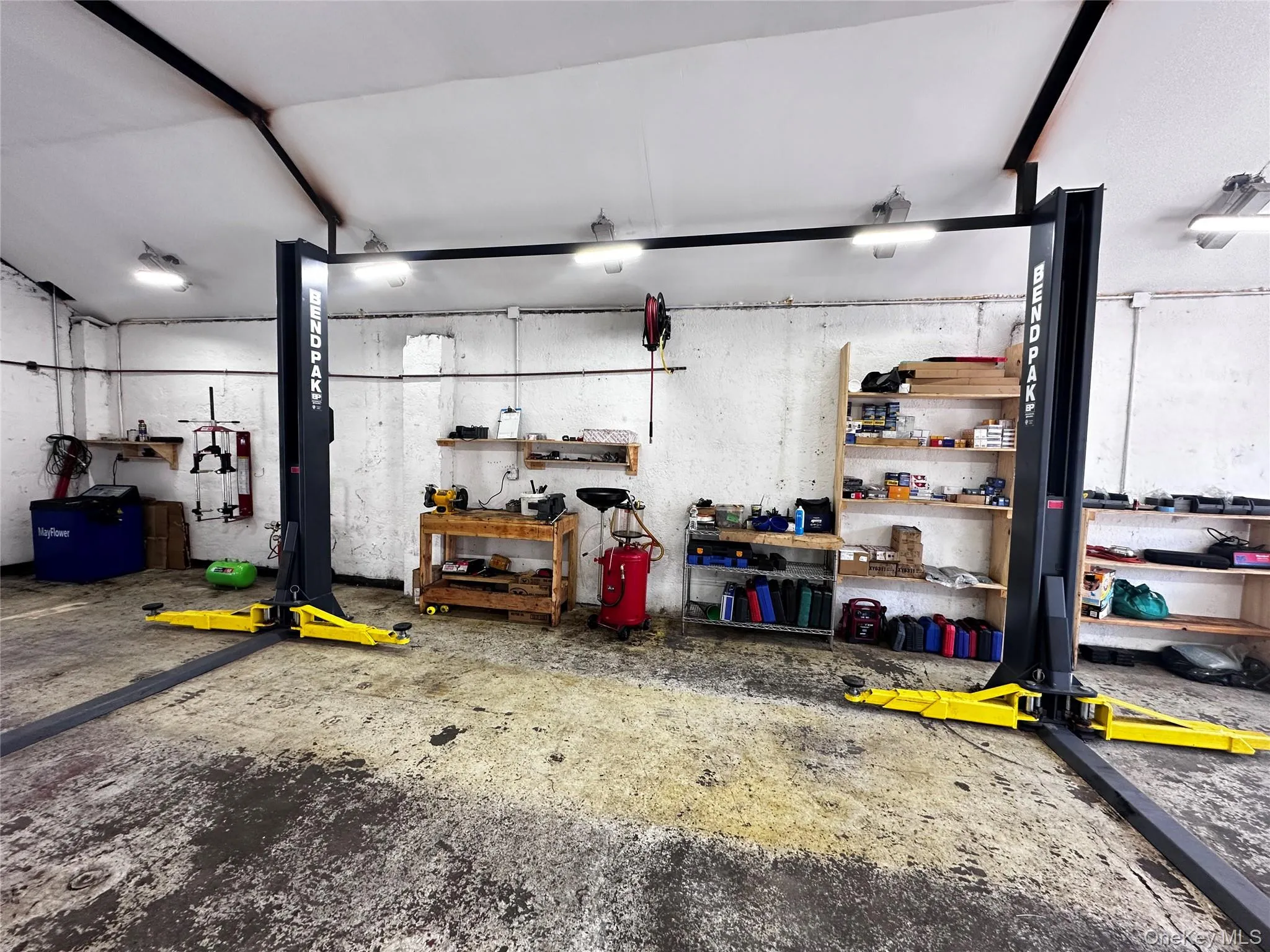 Garage featuring a workshop area Garage featuring a workshop area