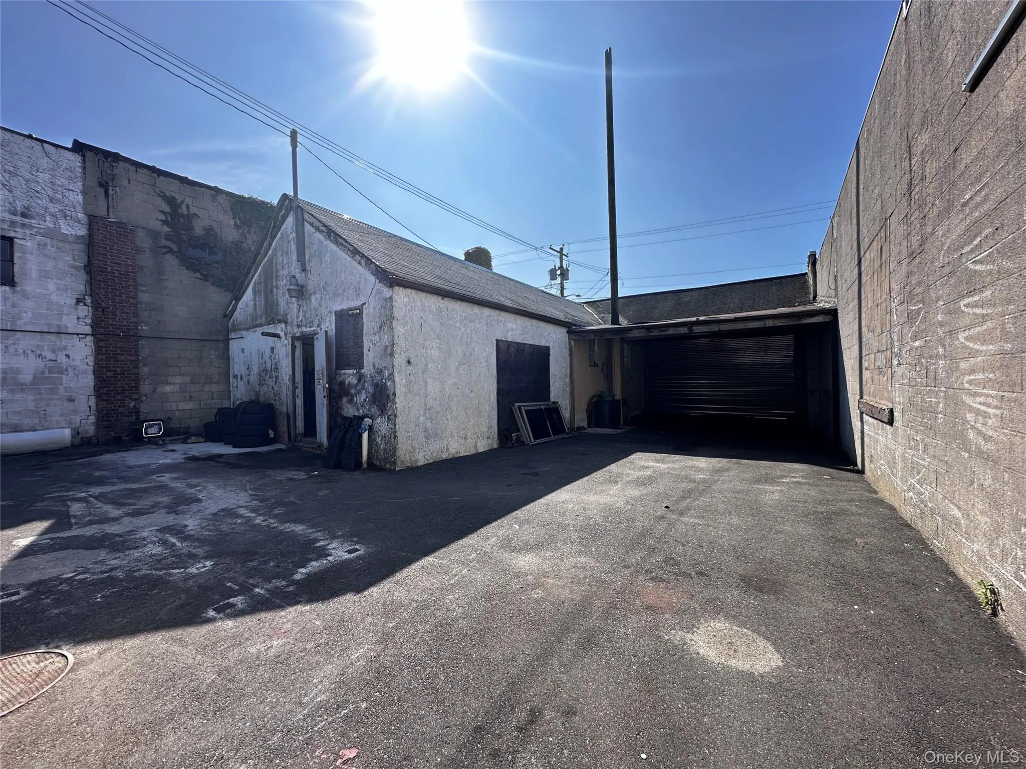 View of home's exterior featuring a garage and stucco siding View of home's exterior featuring a garage and stucco siding