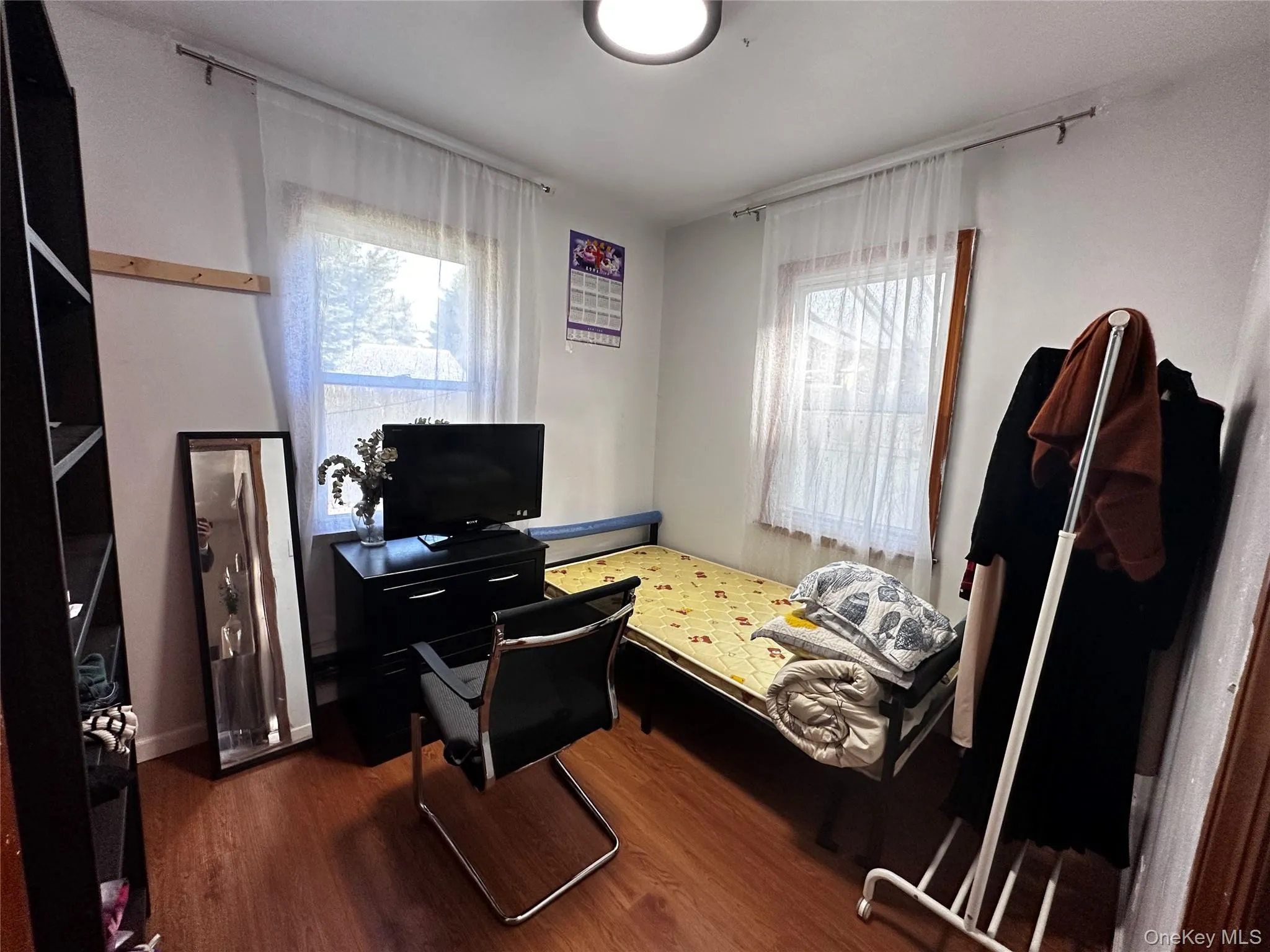 Office area with dark wood finished floors and healthy amount of natural light Office area with dark wood finished floors and healthy amount of natural light
