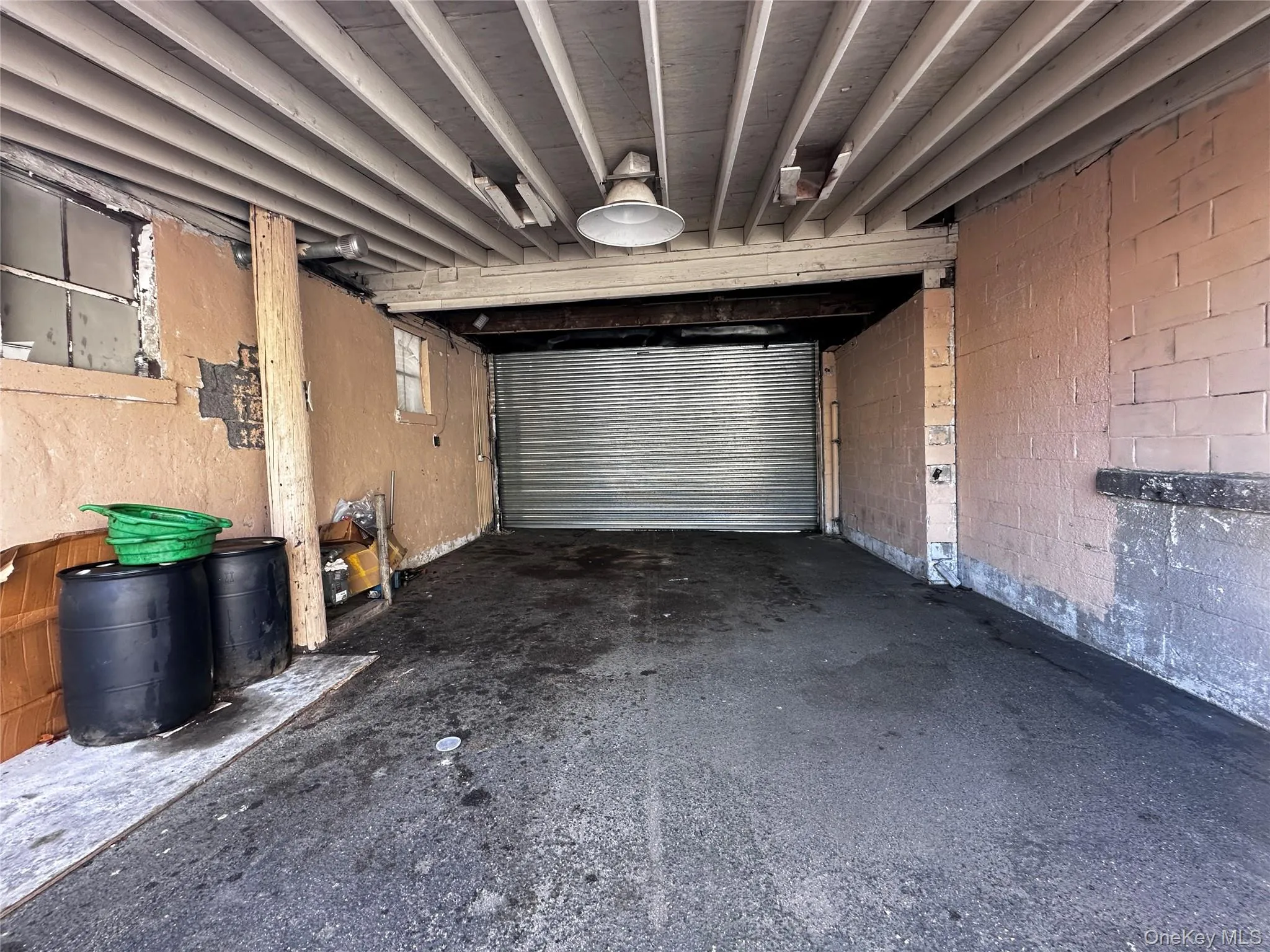 Garage featuring concrete block wall Garage featuring concrete block wall