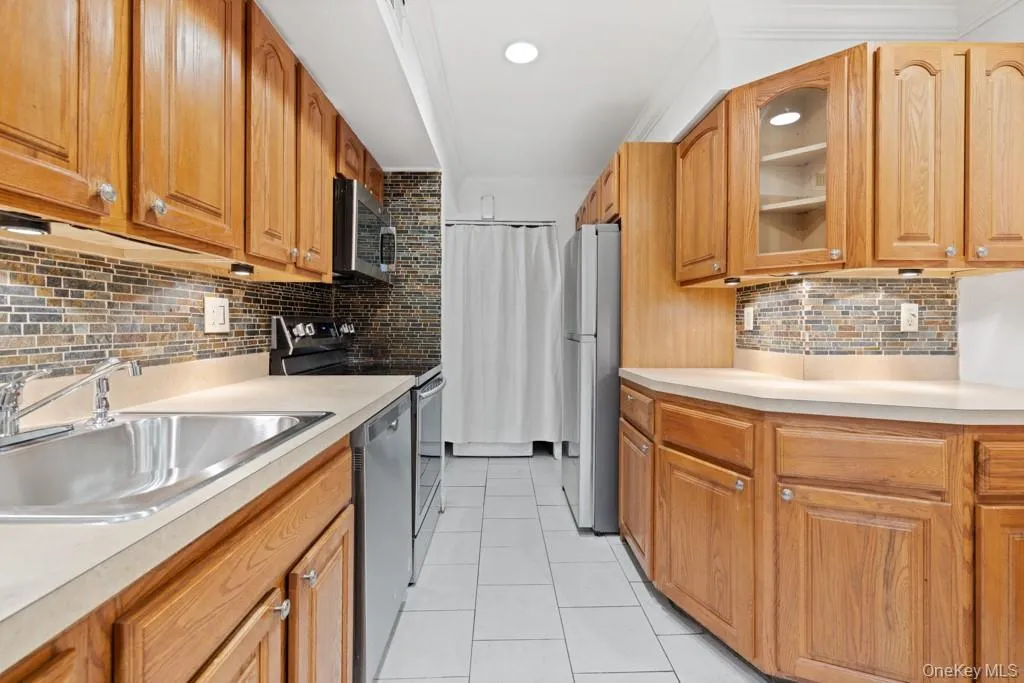Updated kitchen with modern appliances including washer dryer Updated kitchen with modern appliances including washer dryer