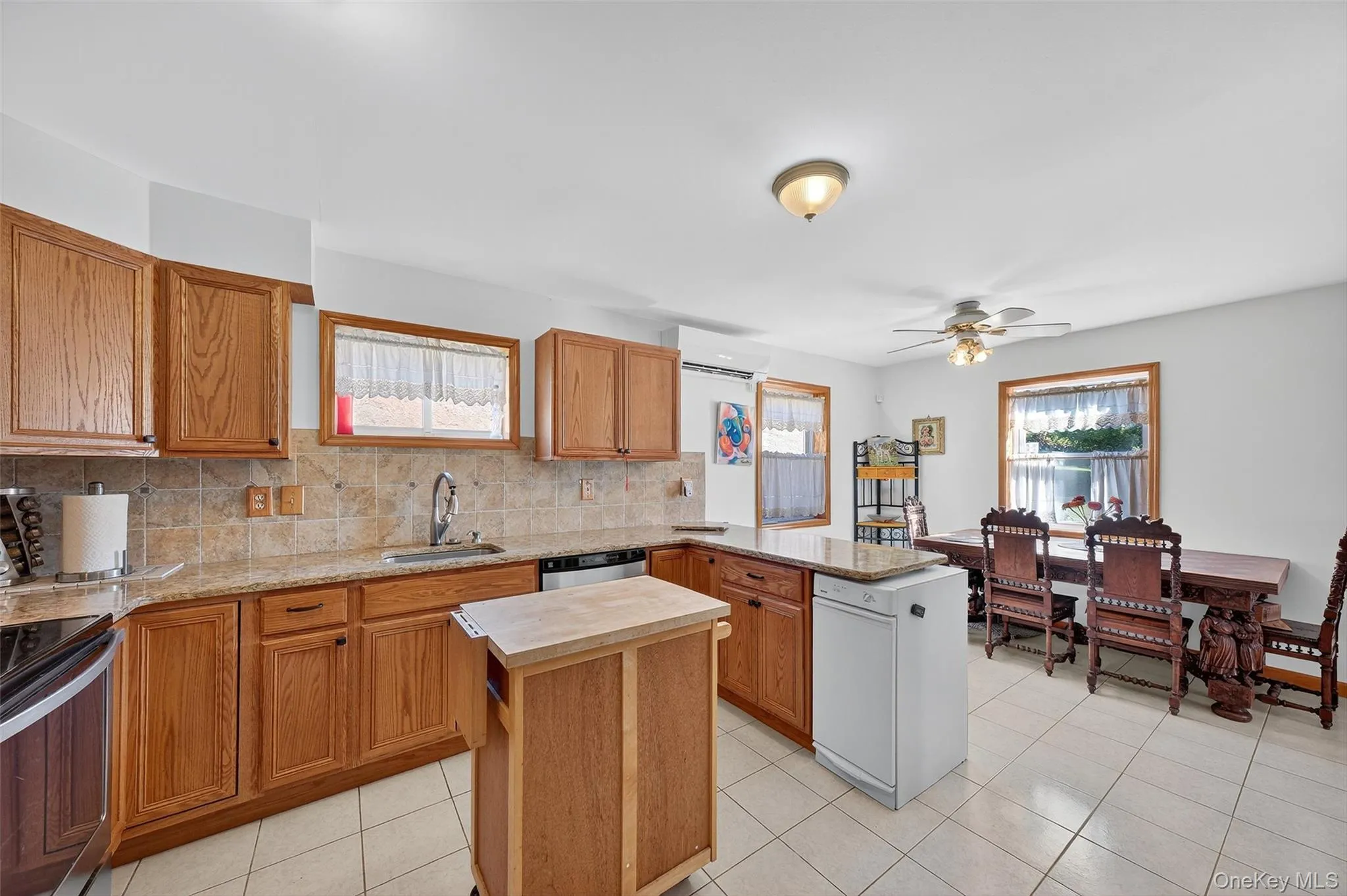 Kitchen with granite countertops, backsplash and stainless steel appliances Kitchen with granite countertops, backsplash and stainless steel appliances