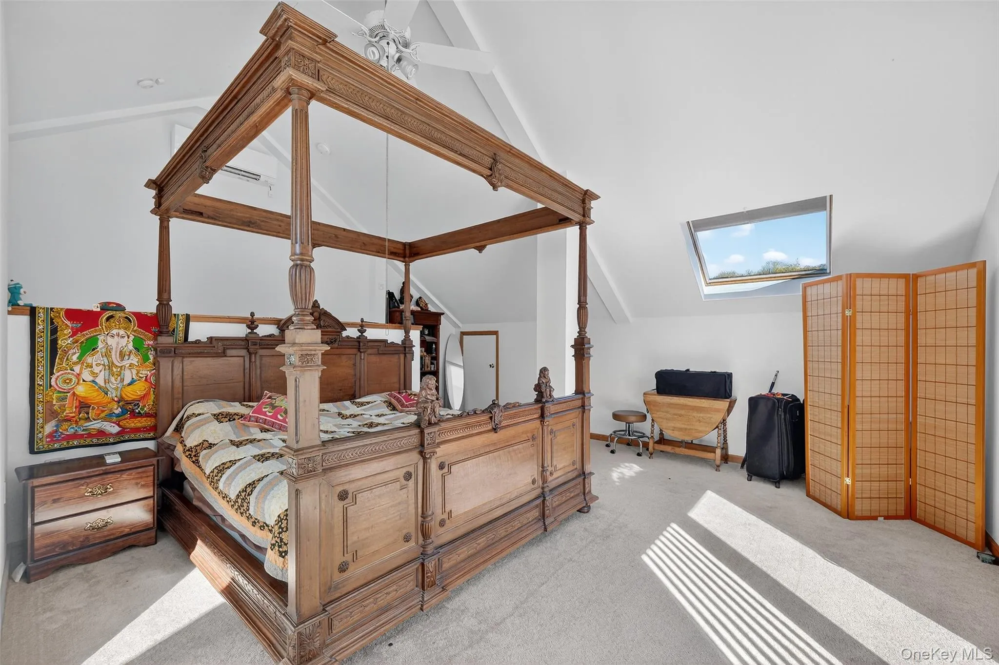 Primary Bedroom with skylights, high ceiling and sliding glass door to balcony Primary Bedroom with skylights, high ceiling and sliding glass door to balcony