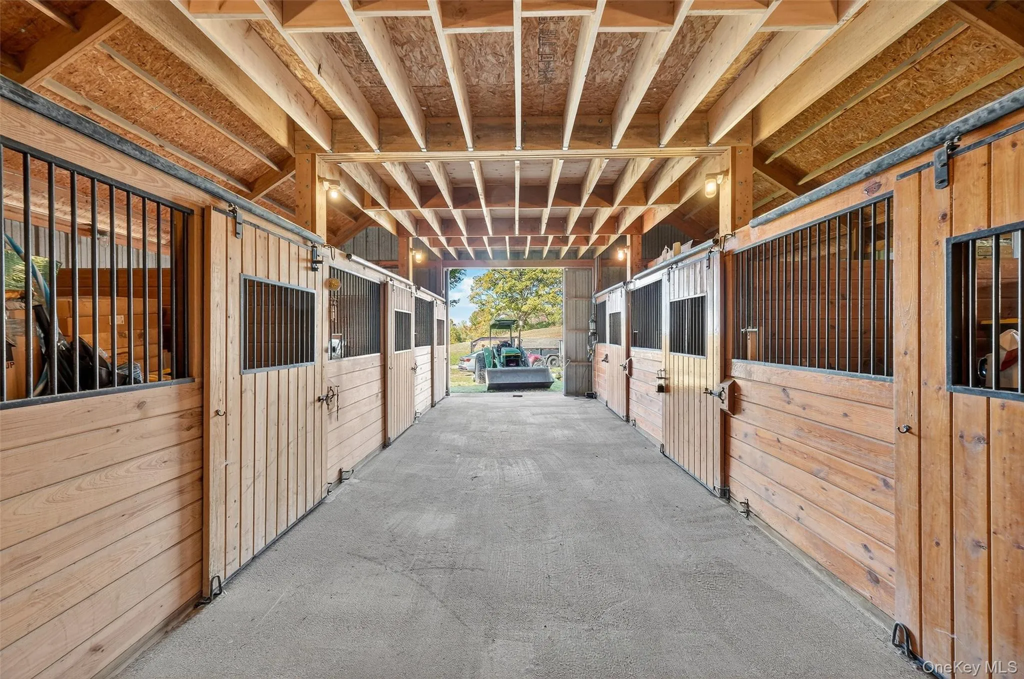 View of horse barn featuring 6 stalls View of horse barn featuring 6 stalls
