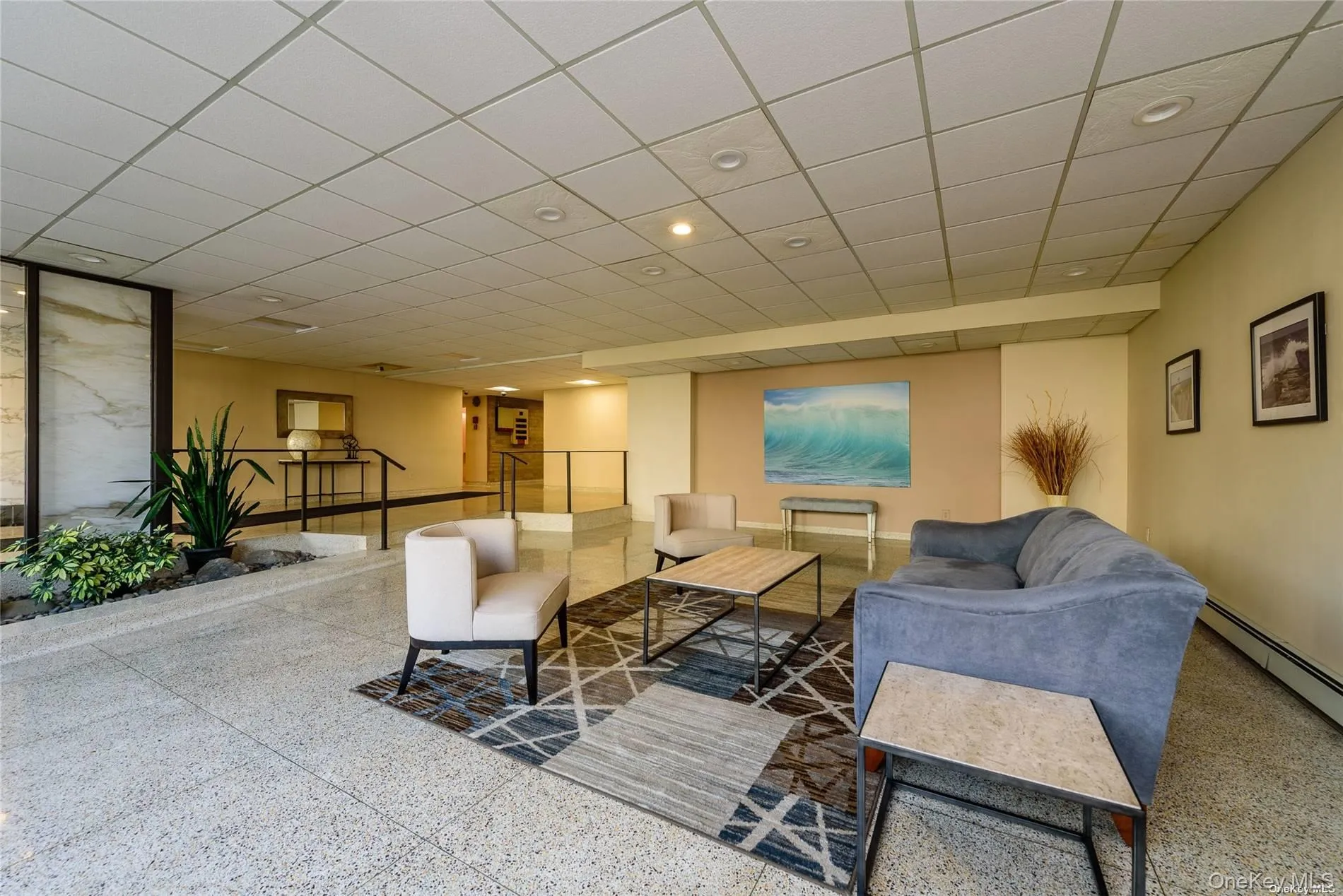 Community lobby featuring a drop ceiling Community lobby featuring a drop ceiling