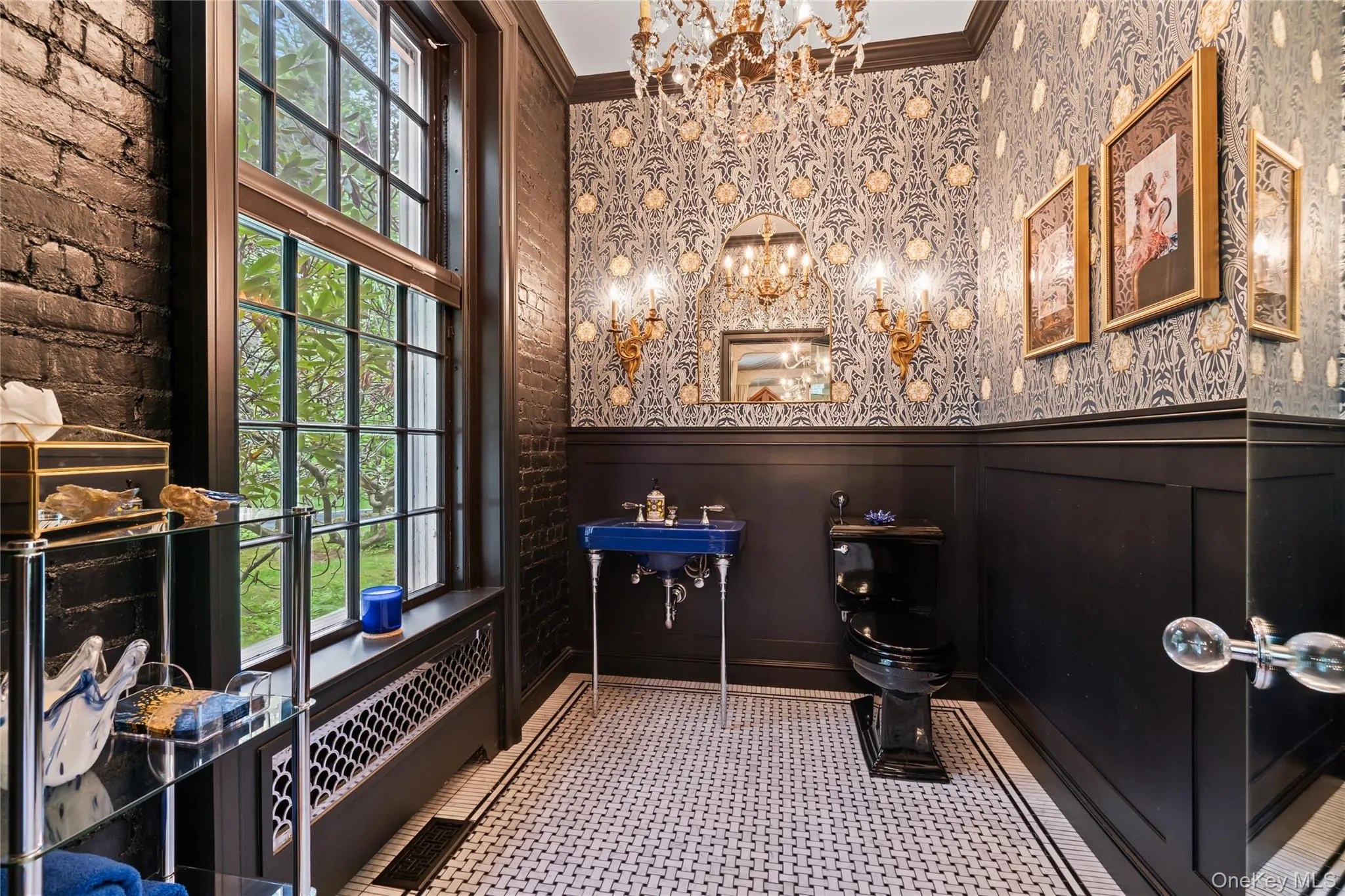 Bathroom featuring a chandelier and crown molding Bathroom featuring a chandelier and crown molding