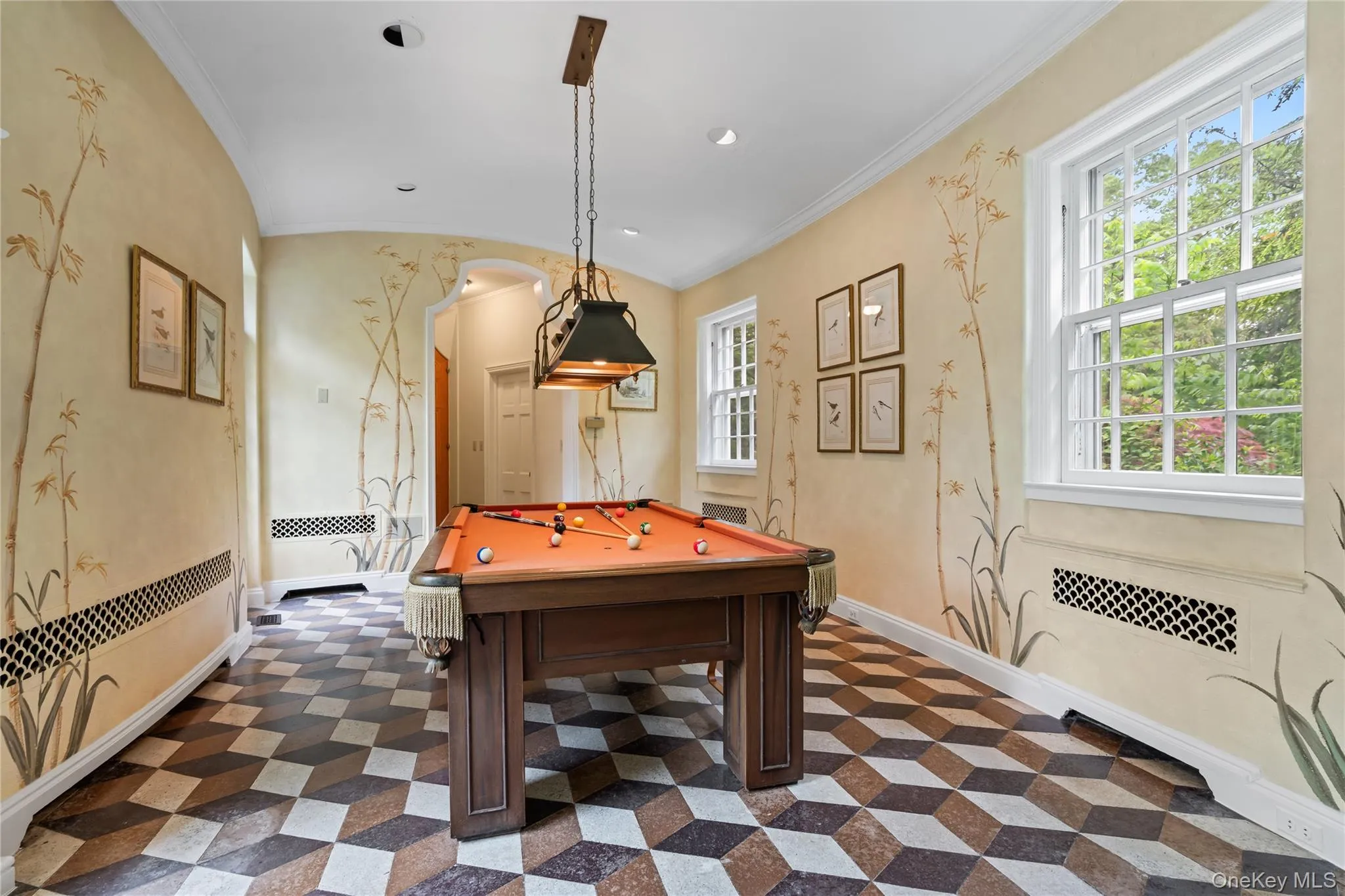 Playroom with ornamental molding, pool table, arched walkways, vaulted ceiling, and recessed lighting Playroom with ornamental molding, pool table, arched walkways, vaulted ceiling, and recessed lighting