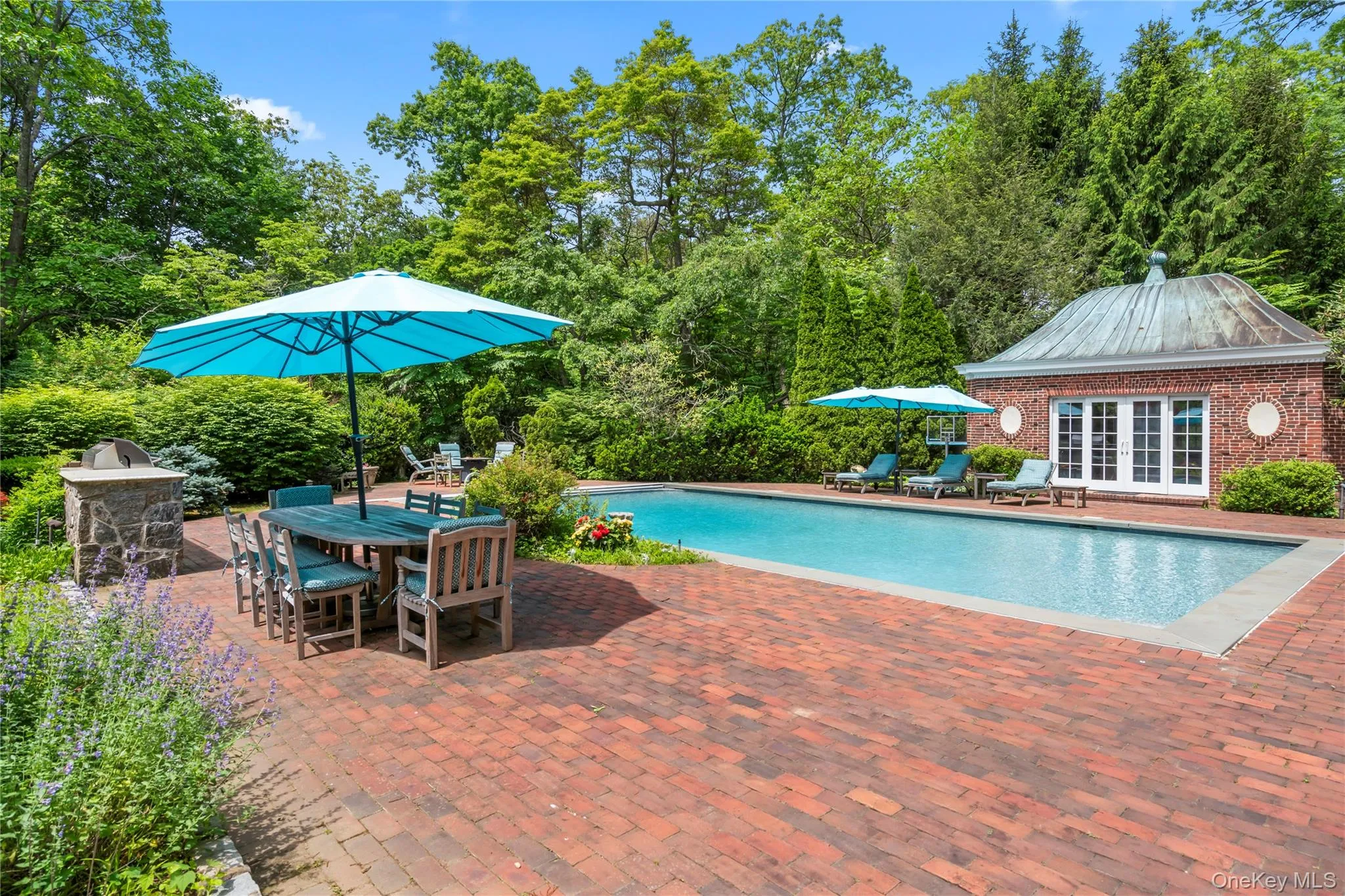 Outdoor pool with a patio area, outdoor dining space, an exterior structure, an outbuilding, and french doors Outdoor pool with a patio area, outdoor dining space, an exterior structure, an outbuilding, and french doors
