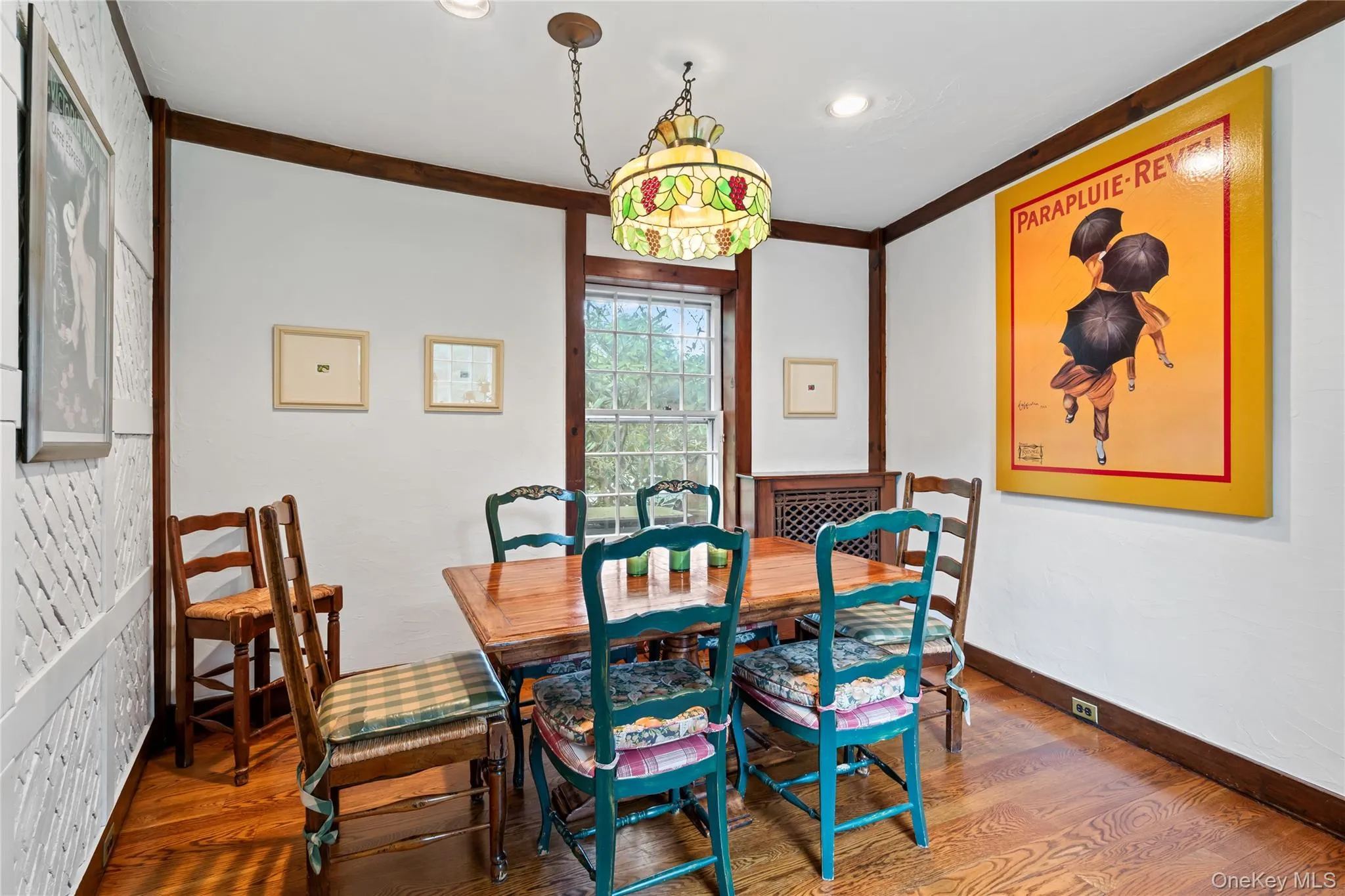 Dining space featuring wood finished floors, crown molding, and recessed lighting Dining space featuring wood finished floors, crown molding, and recessed lighting