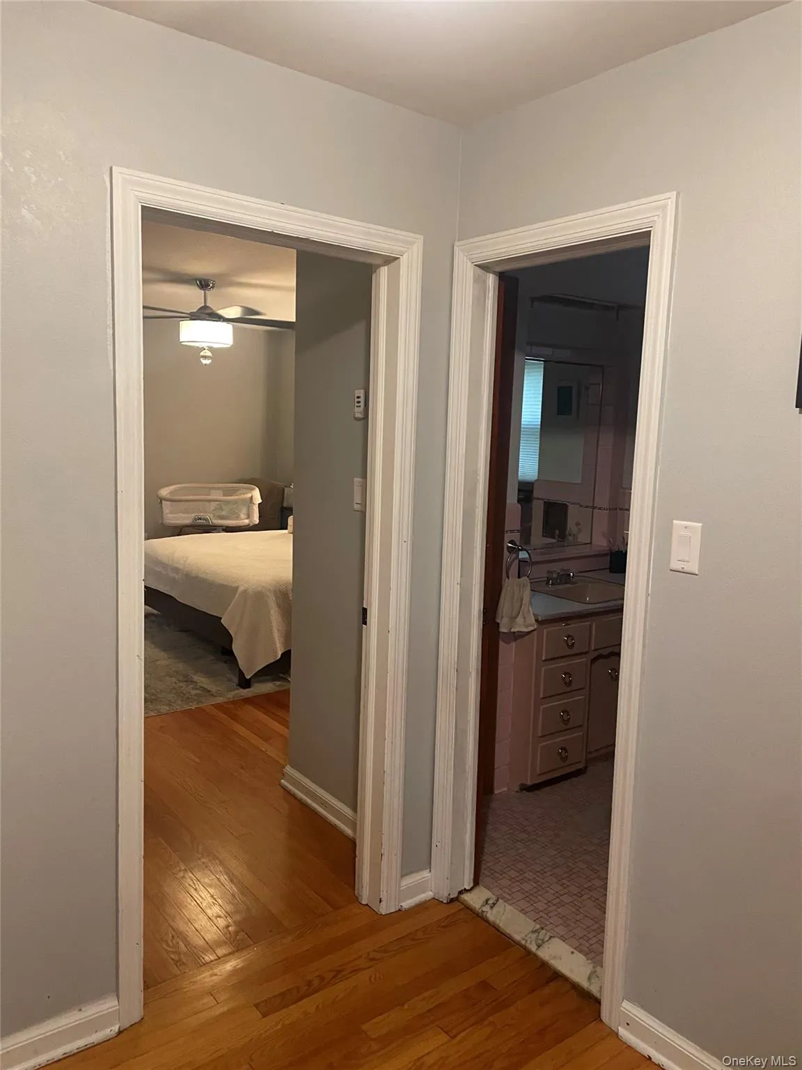 Hall with light wood-type flooring and baseboards Hall with light wood-type flooring and baseboards