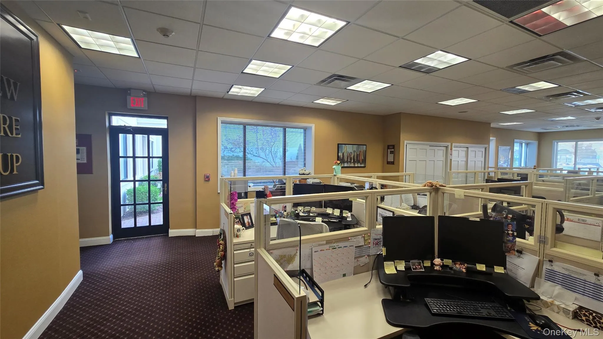 Office space with a paneled ceiling Office space with a paneled ceiling