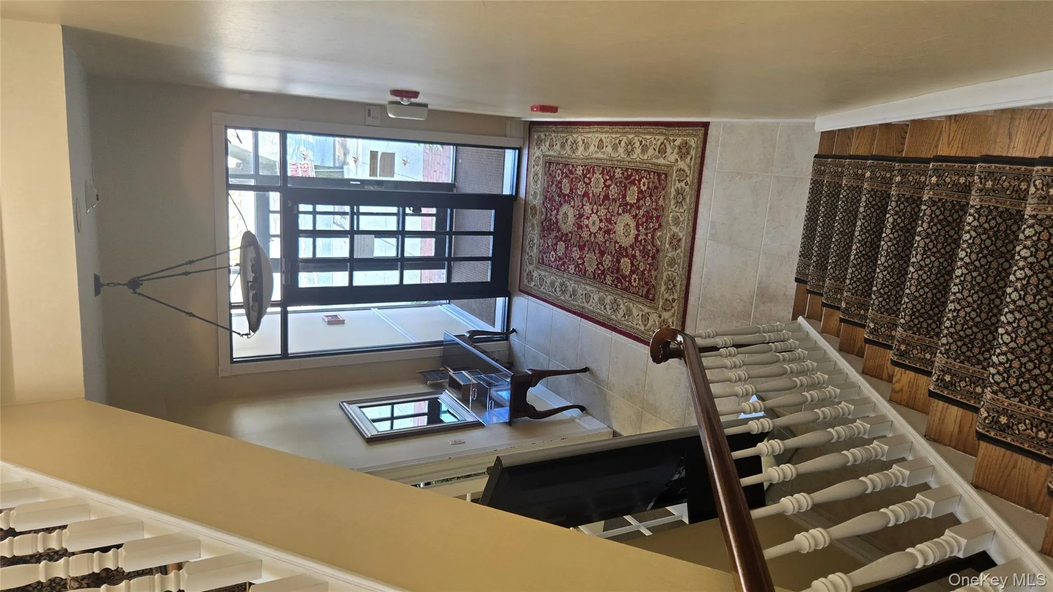 Entryway featuring stairs and light wood finished floors Entryway featuring stairs and light wood finished floors