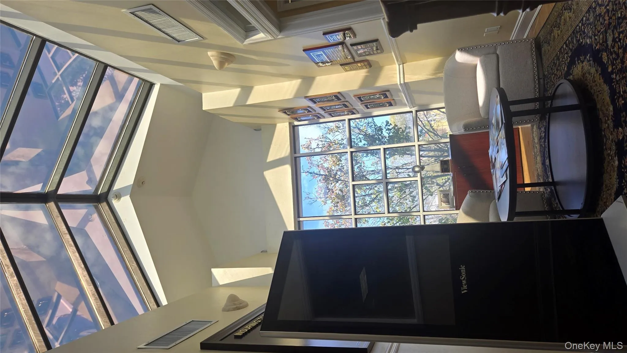 Living room featuring vaulted ceiling Living room featuring vaulted ceiling