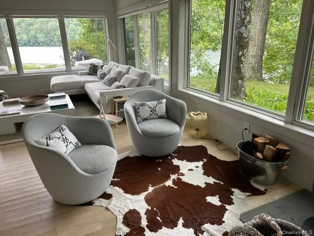 Sunroom featuring a water view Sunroom featuring a water view