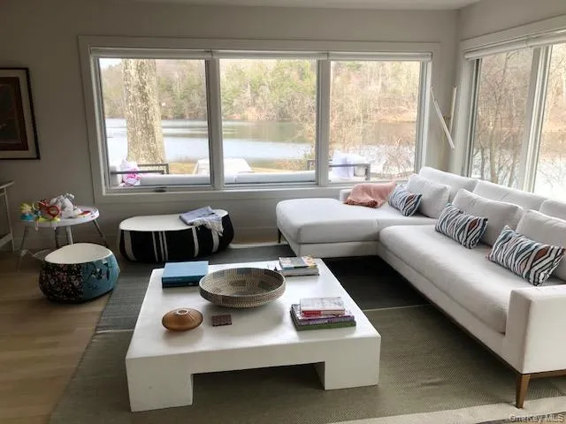 Sunny living room with a water view Sunny living room with a water view