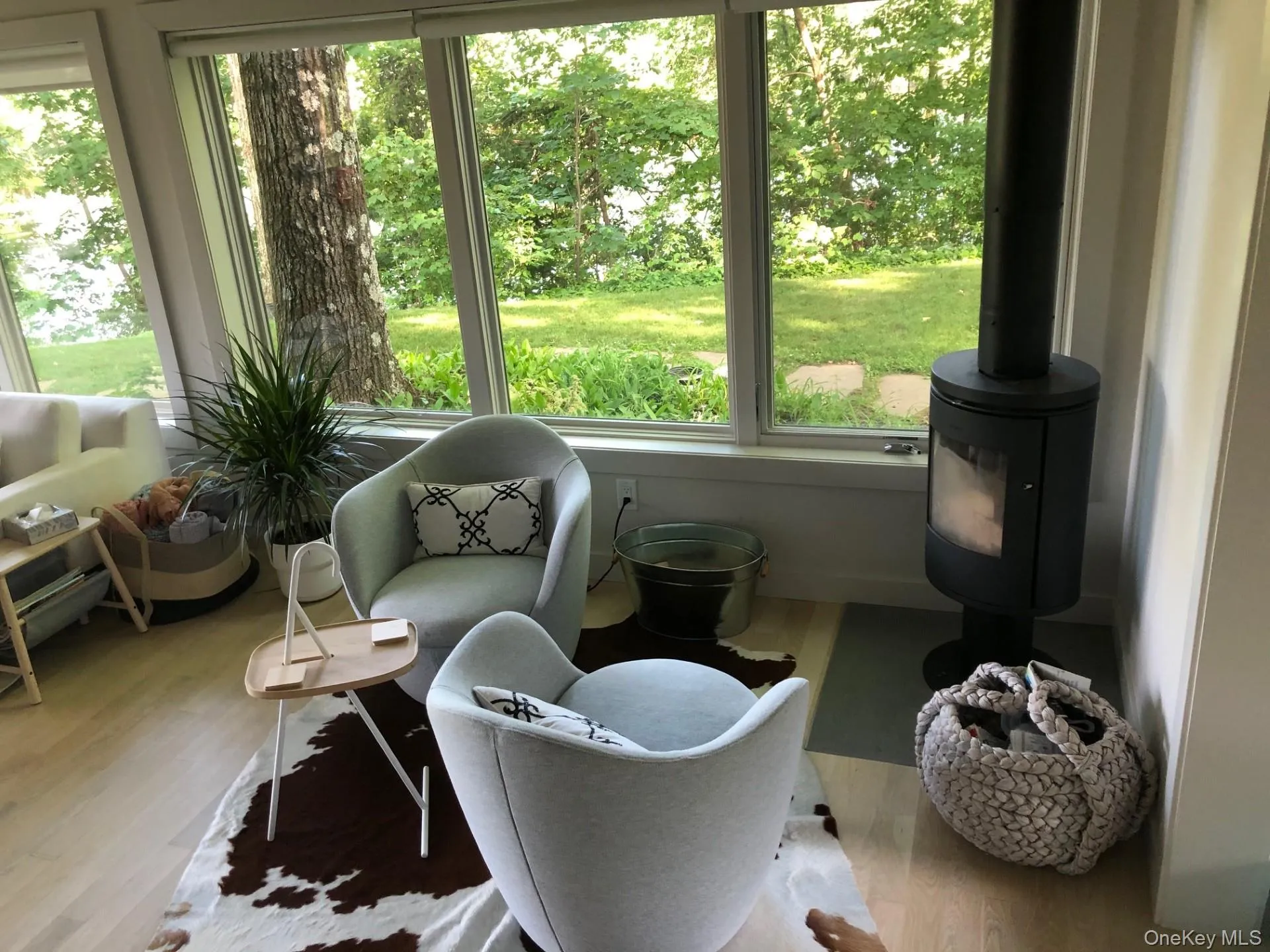 Sunroom featuring wood finished floors Sunroom featuring wood finished floors