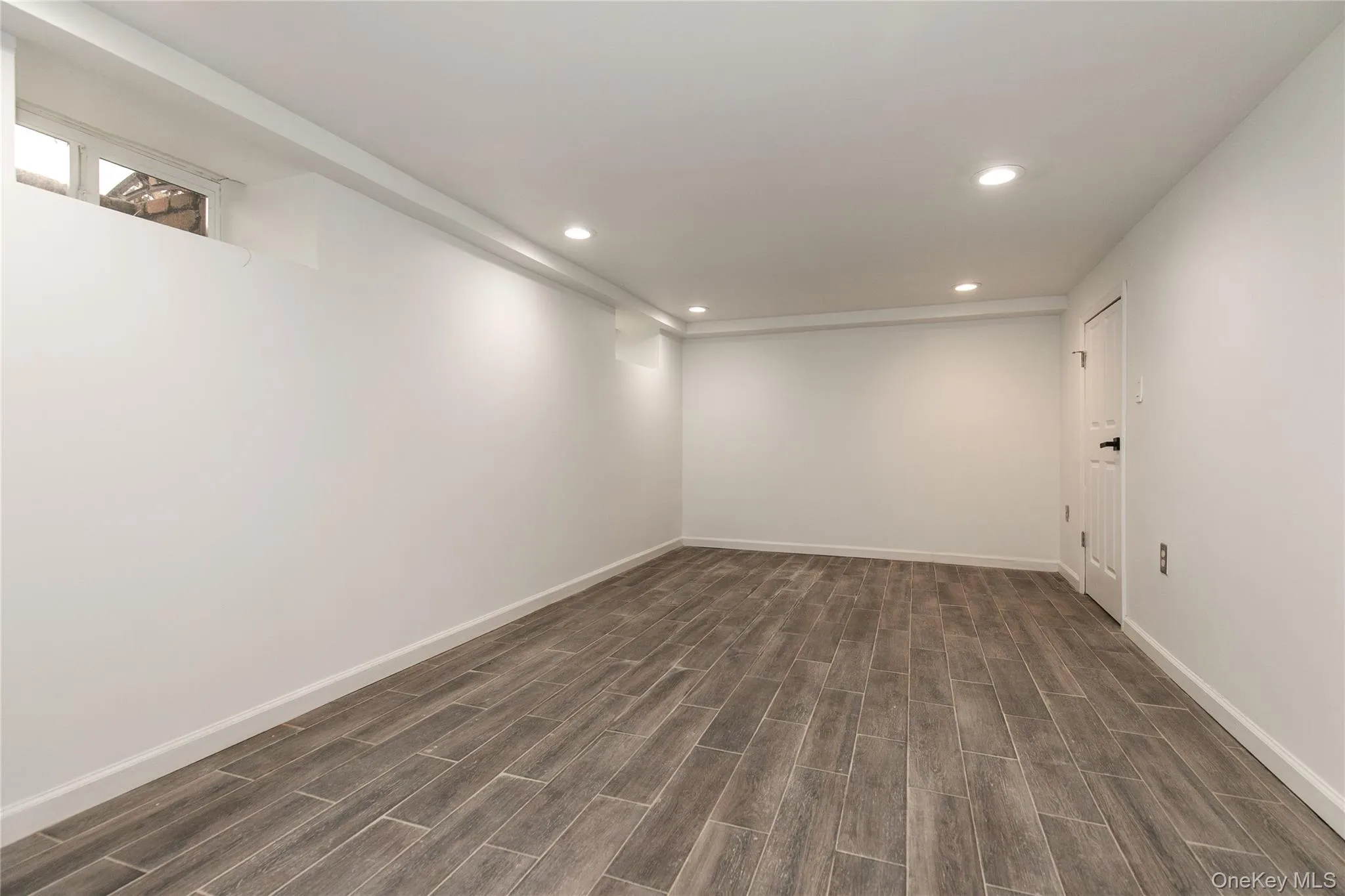 Spare room with recessed lighting and wood finish floors Spare room with recessed lighting and wood finish floors