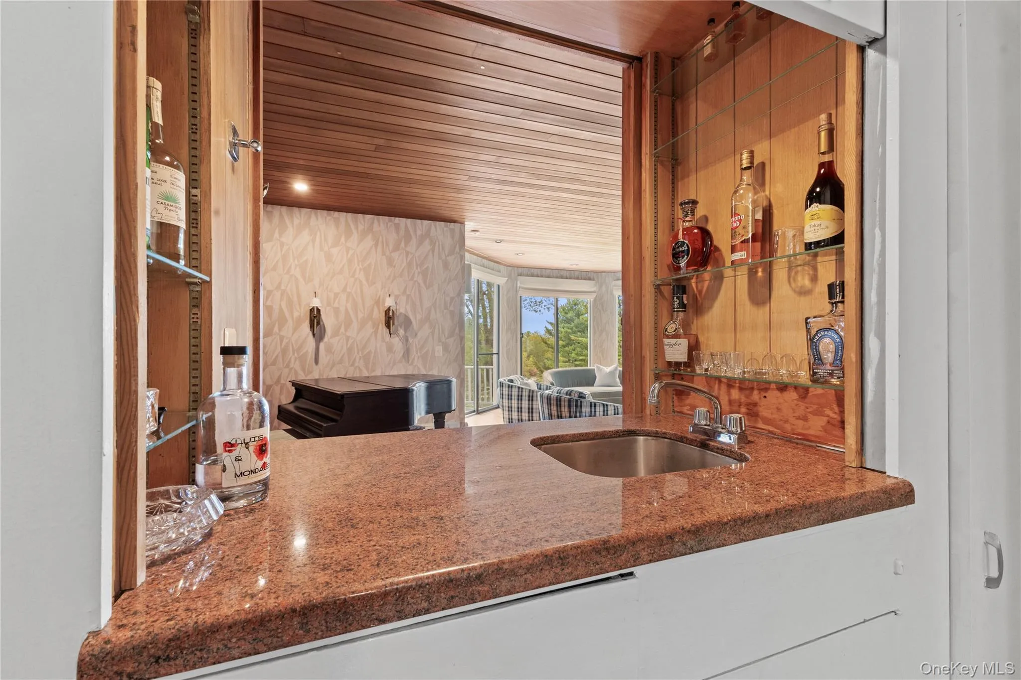 Kitchen with wood ceiling and dark stone counters Kitchen with wood ceiling and dark stone counters