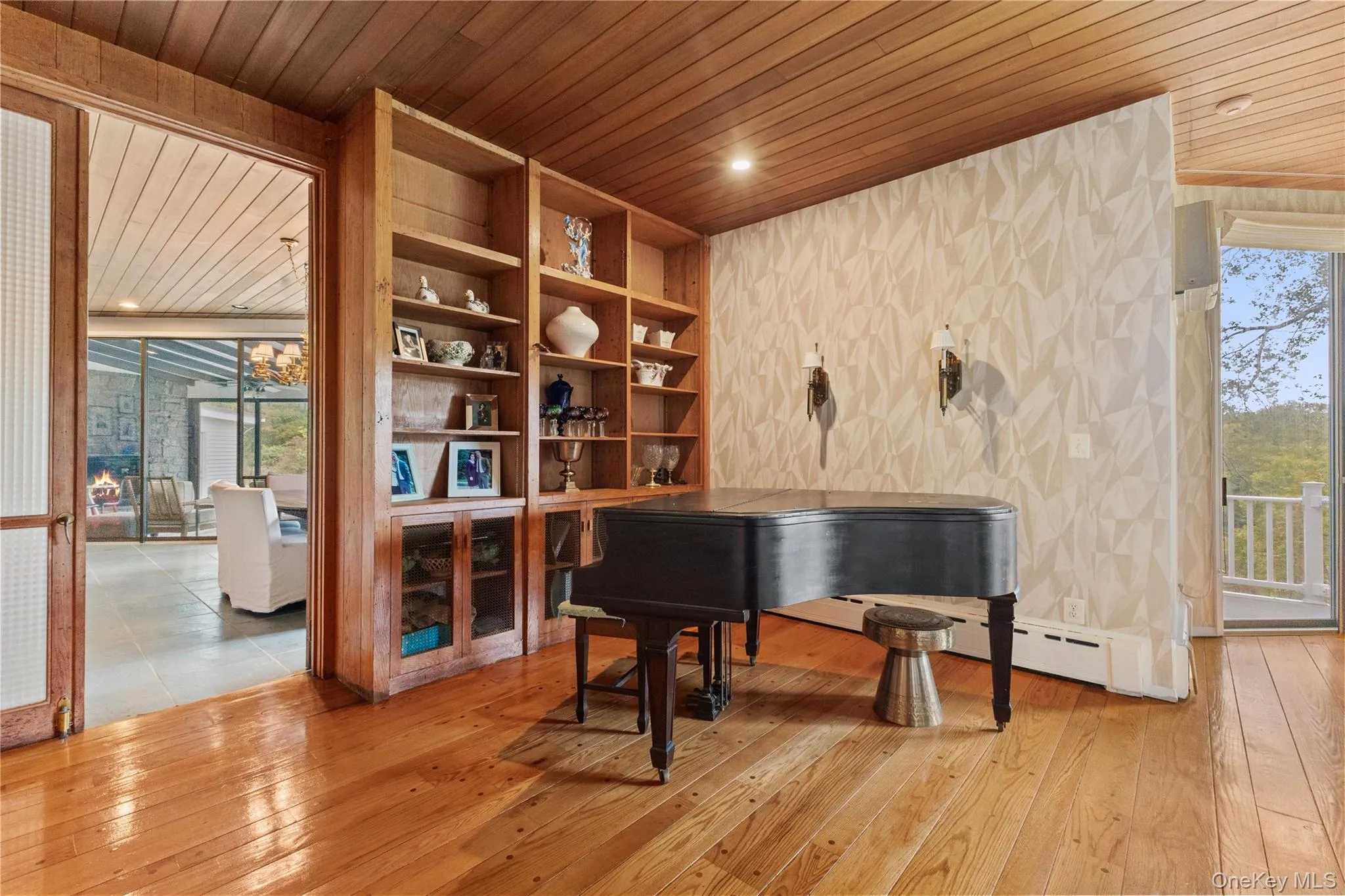 Living area with wood ceiling, light wood-style flooring, and recessed lighting Living area with wood ceiling, light wood-style flooring, and recessed lighting