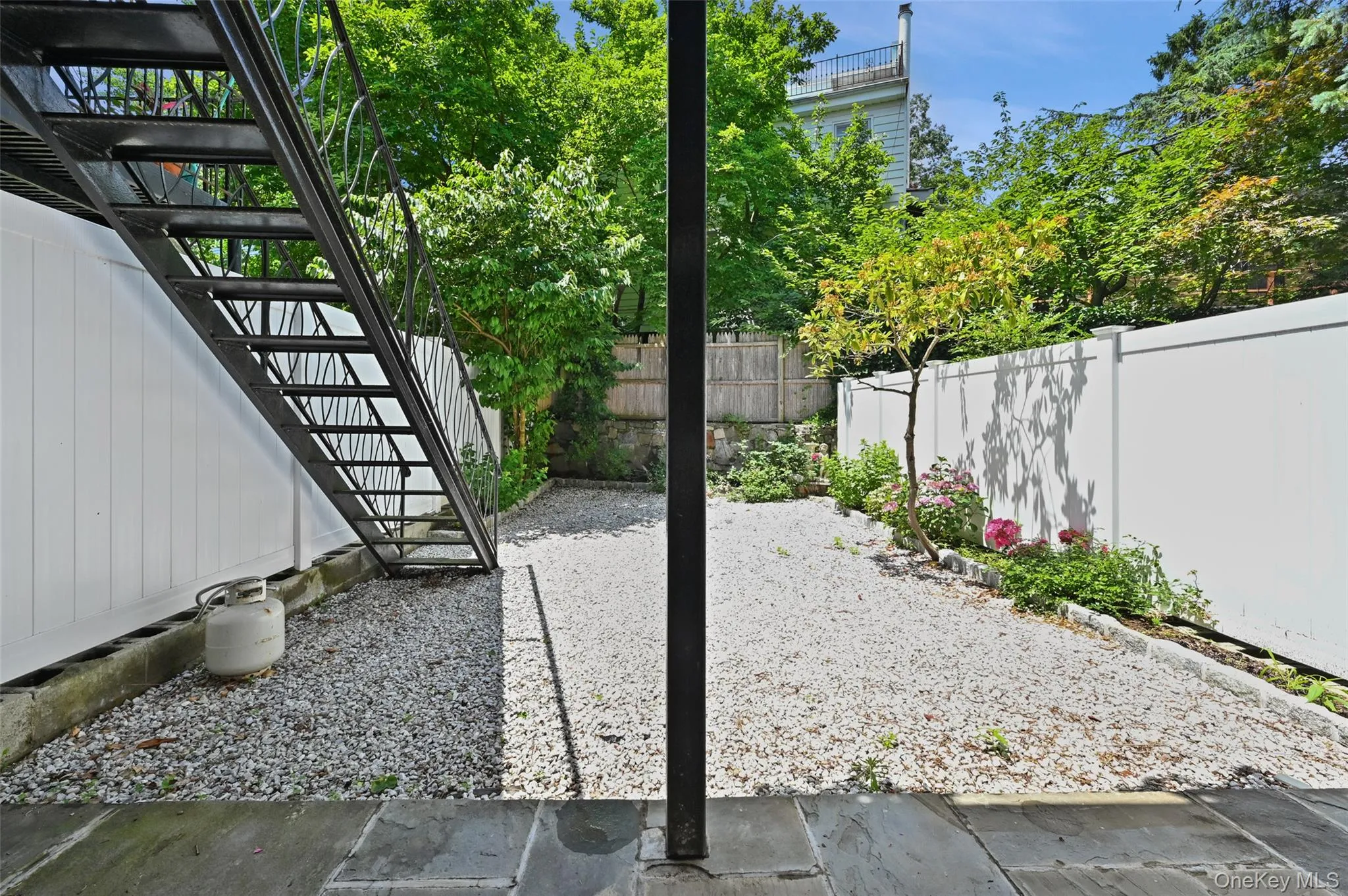 Fenced backyard with stairway Fenced backyard with stairway