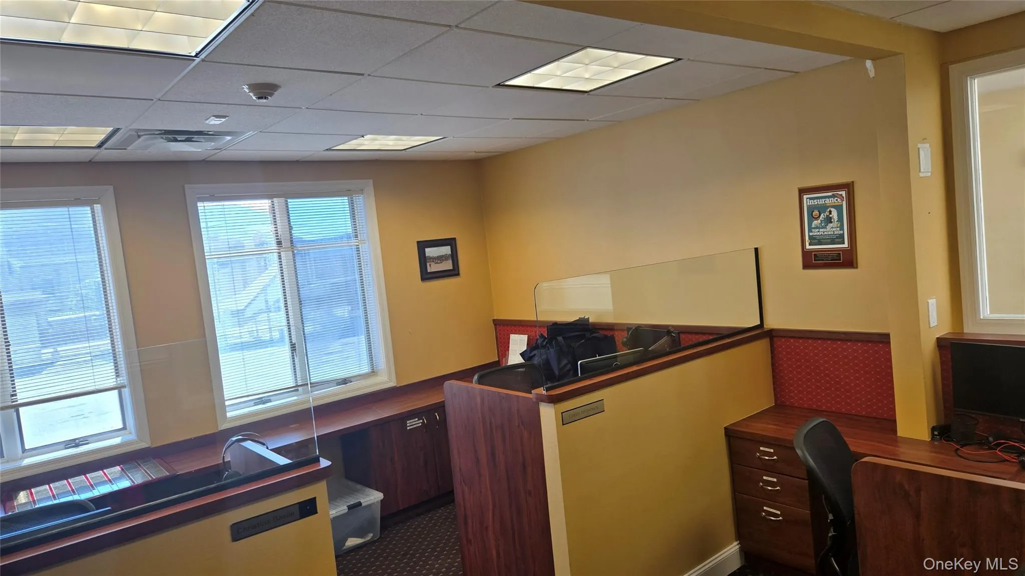 Office area with a paneled ceiling Office area with a paneled ceiling