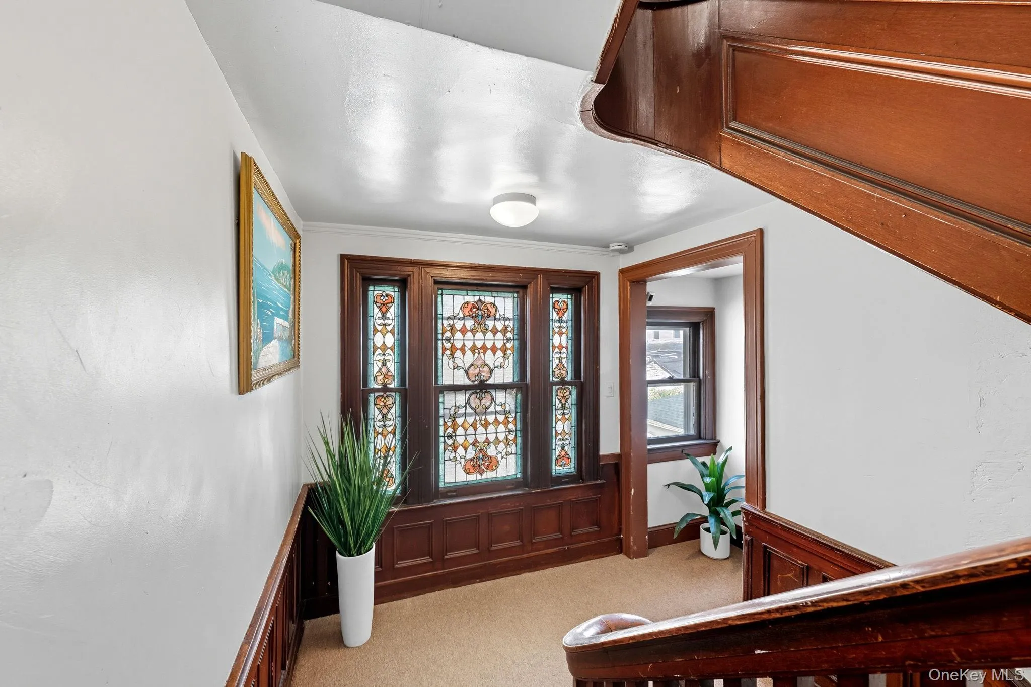 Entryway featuring light carpet Entryway featuring light carpet