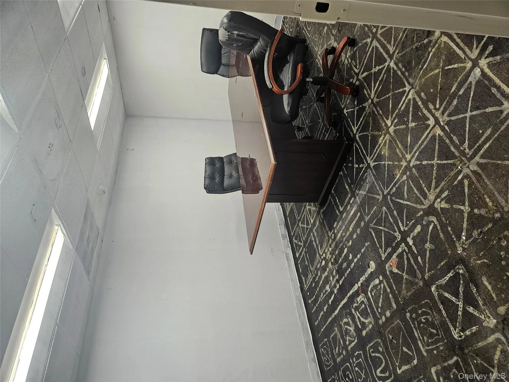 Office featuring a drop ceiling and baseboards Office featuring a drop ceiling and baseboards