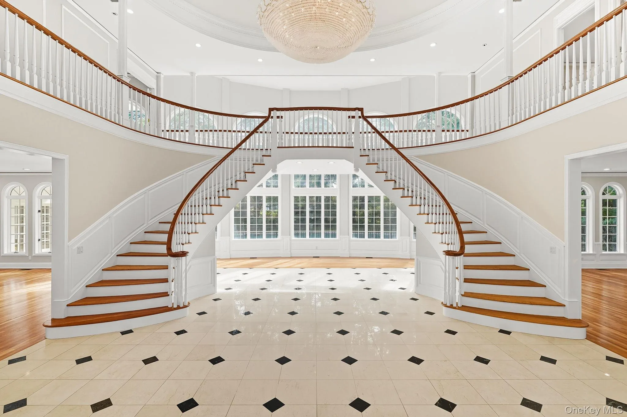 Dramatic palatial 31 foot high domed marble foyer with a grand sweeping double staircase Dramatic palatial 31 foot high domed marble foyer with a grand sweeping double staircase
