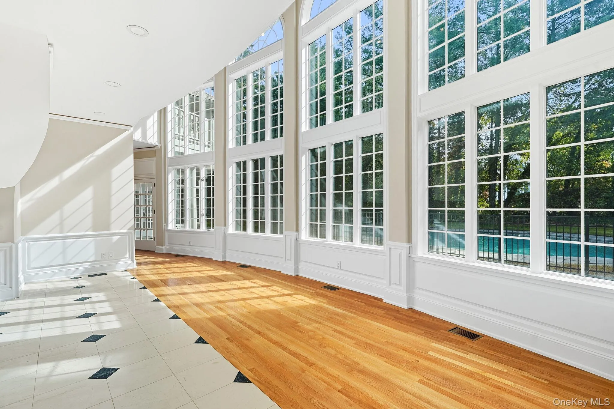 Conservatory with floor to ceiling bay windows Conservatory with floor to ceiling bay windows