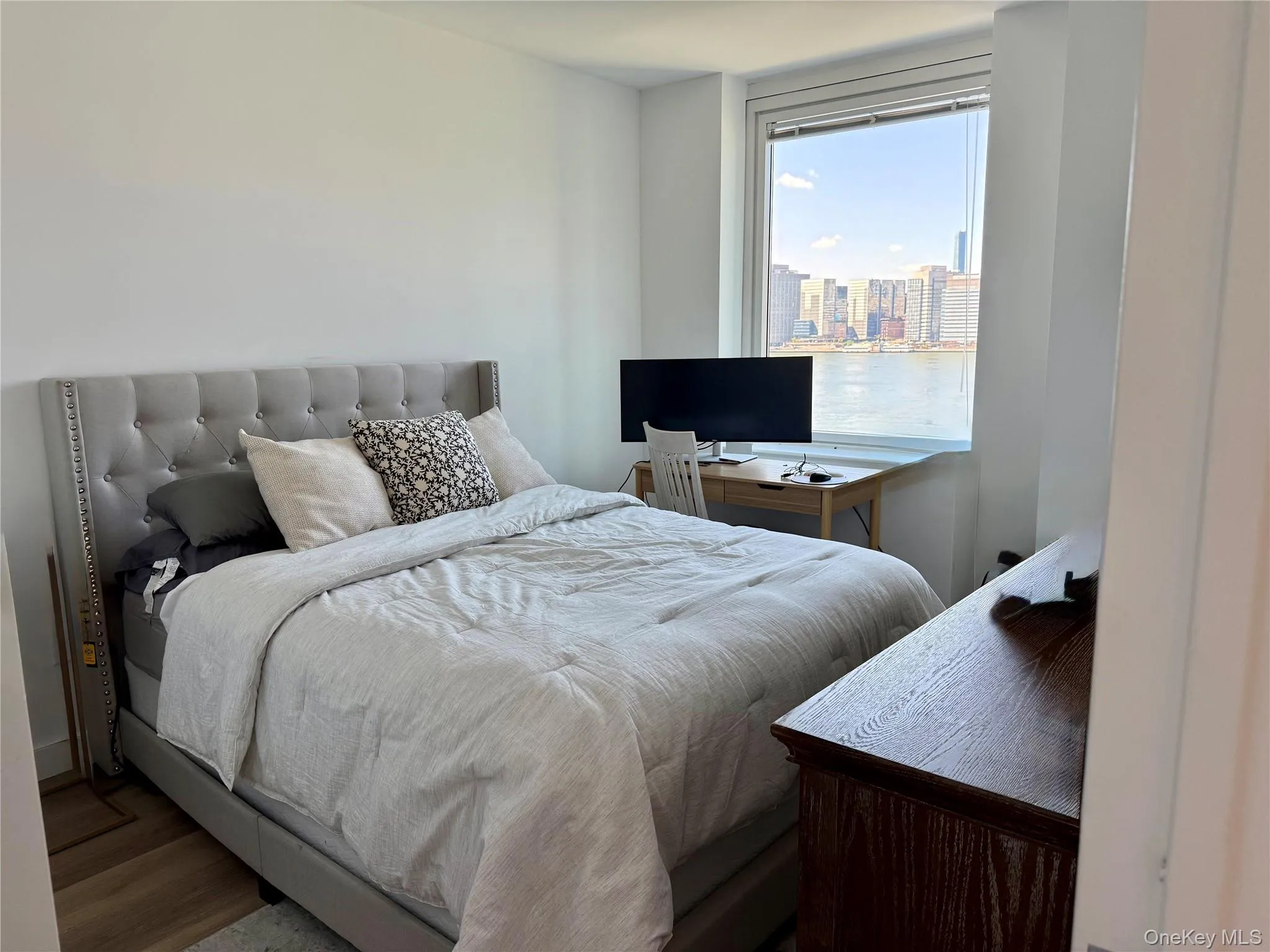 Primary Bedroom featuring View of Manhattan Primary Bedroom featuring View of Manhattan