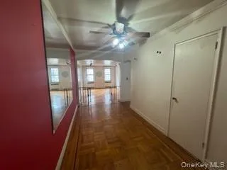 Hallway with baseboards and ornamental molding Hallway with baseboards and ornamental molding