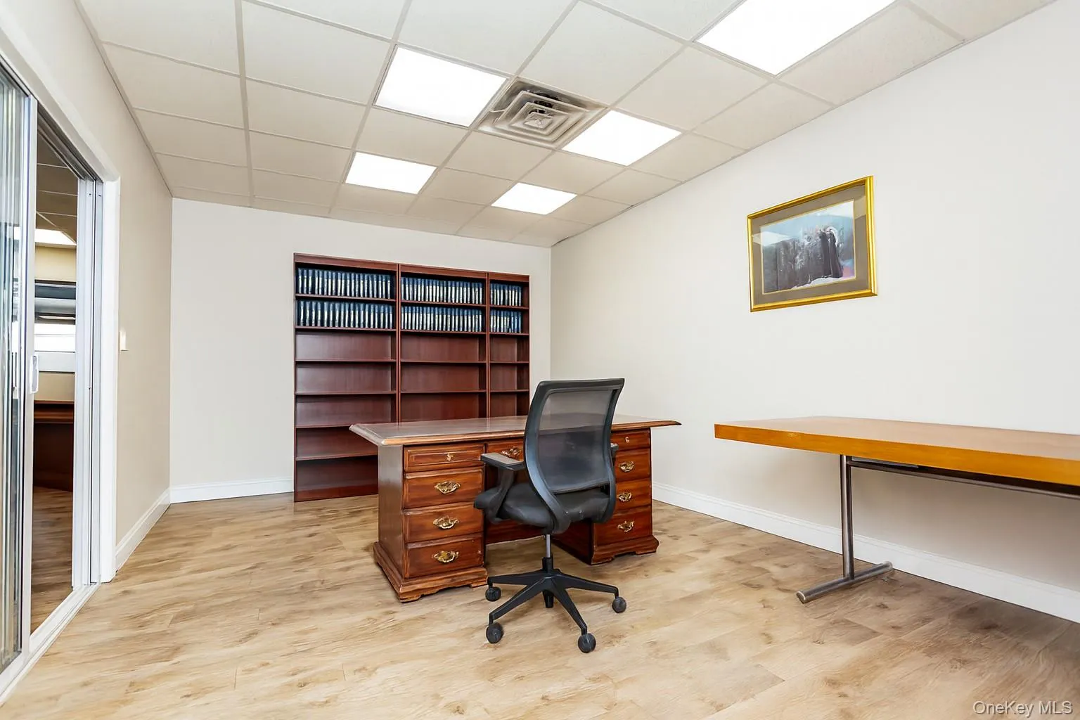 (Digitally Decluttered) Office space featuring a drop ceiling and light wood-type flooring (Digitally Decluttered) Office space featuring a drop ceiling and light wood-type flooring