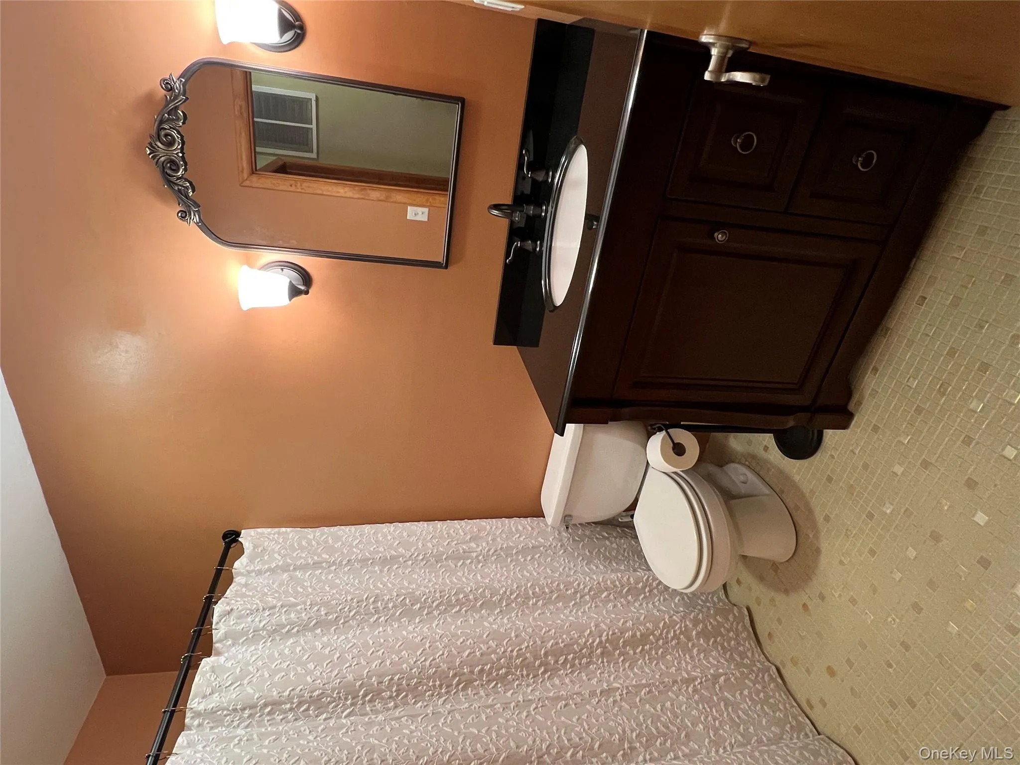 Full bath featuring vanity and a shower with curtain Full bath featuring vanity and a shower with curtain