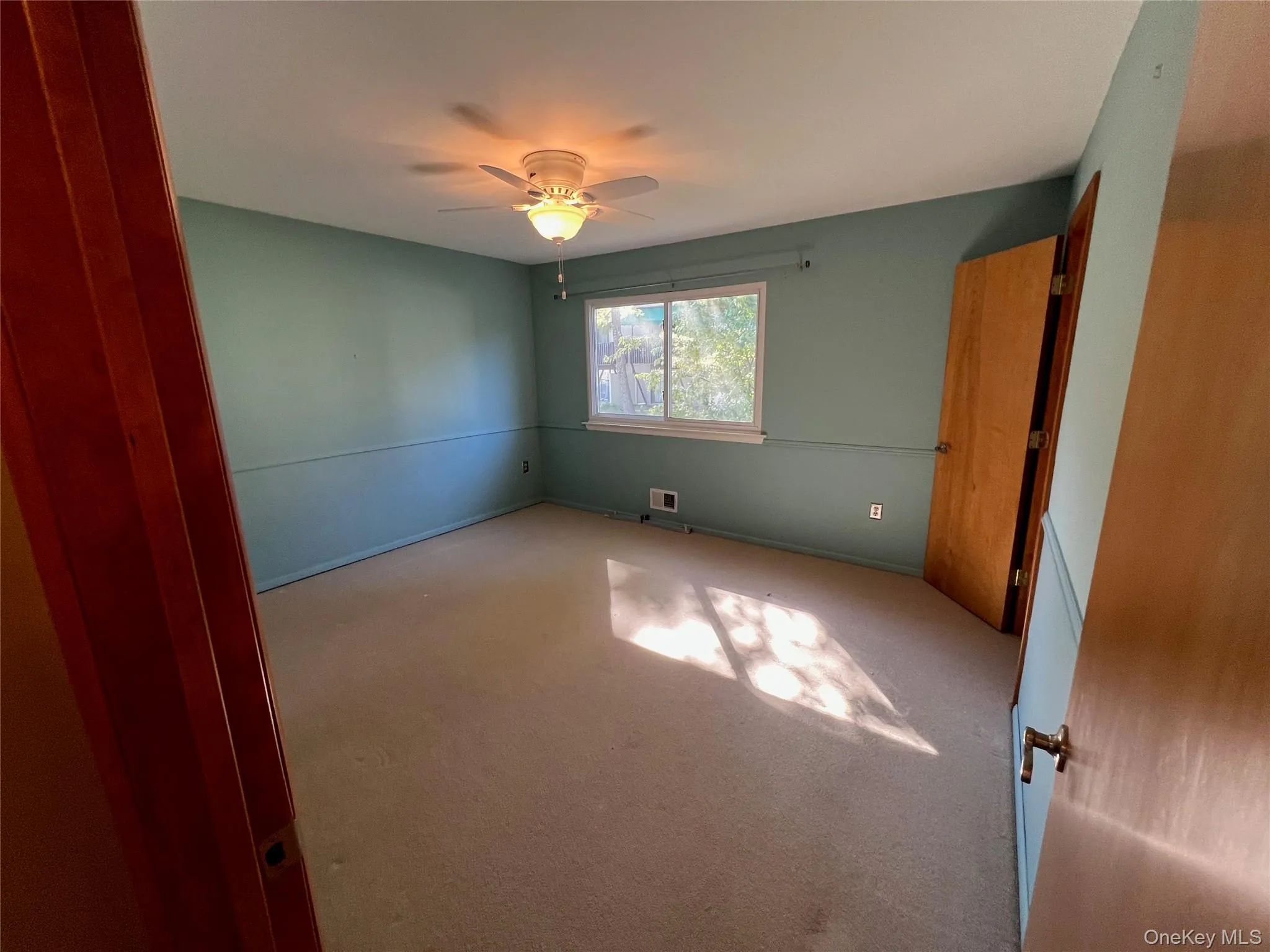 bedroom with a ceiling fan and carpet flooring bedroom with a ceiling fan and carpet flooring
