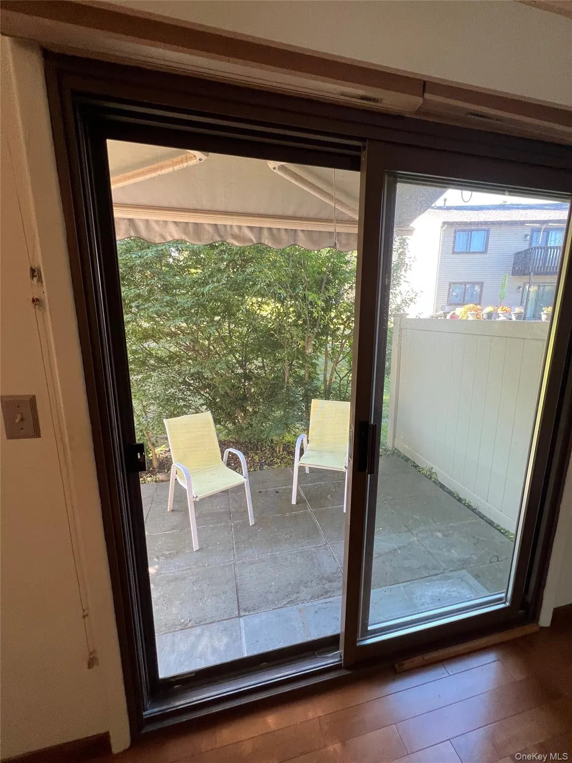 Entryway to patio featuring wood finished floors Entryway to patio featuring wood finished floors