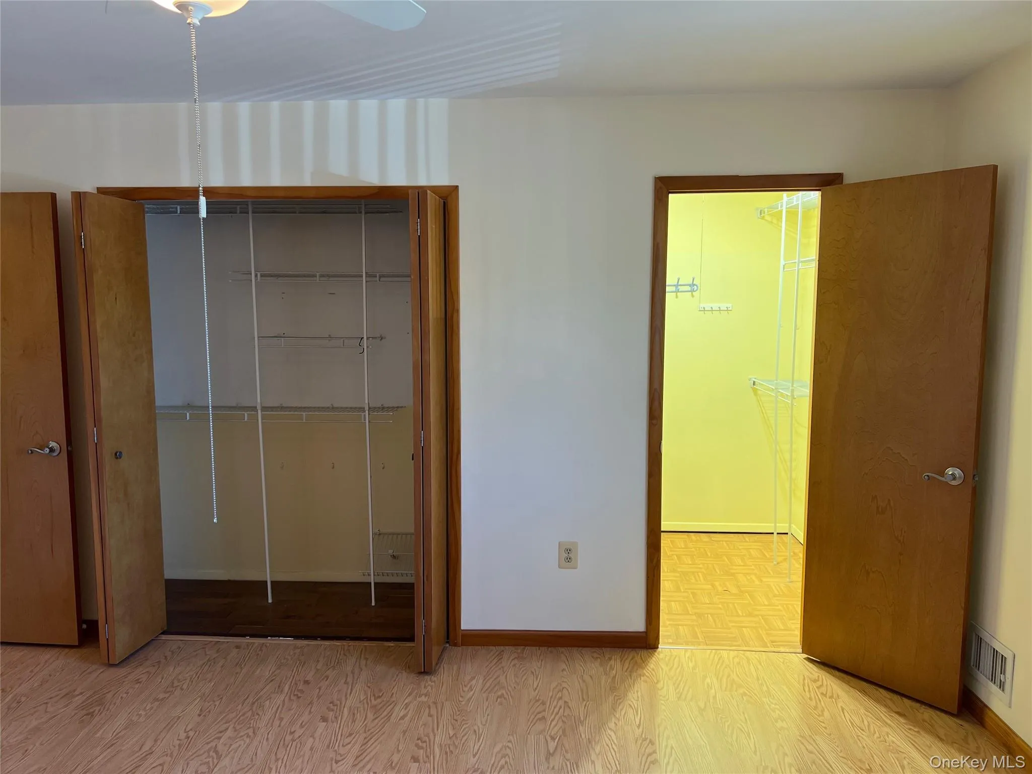 Bedroom featuring light wood-style floors, a closet, and ceiling fan Bedroom featuring light wood-style floors, a closet, and ceiling fan