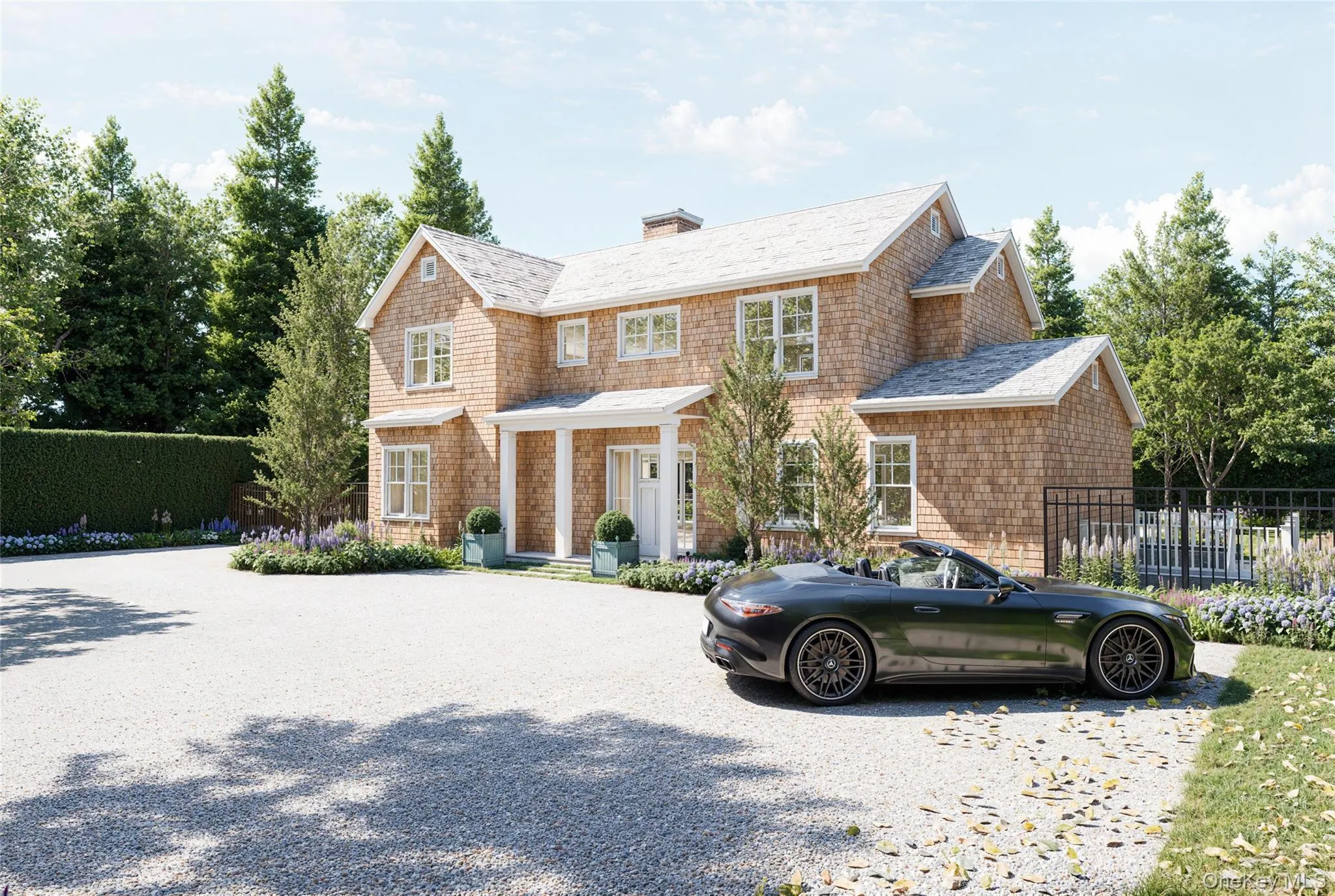 Shingle-style home featuring a chimney, a porch, and gravel driveway Shingle-style home featuring a chimney, a porch, and gravel driveway