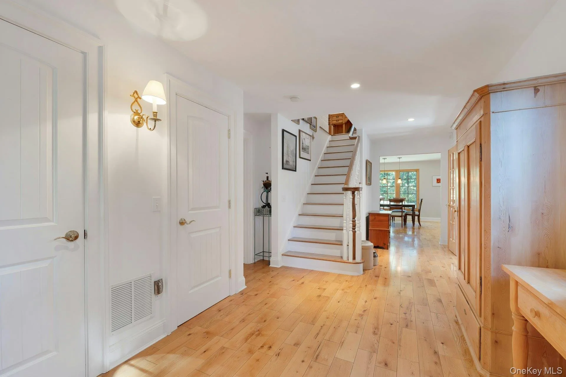 Staircase with wood-type flooring and recessed lighting Staircase with wood-type flooring and recessed lighting