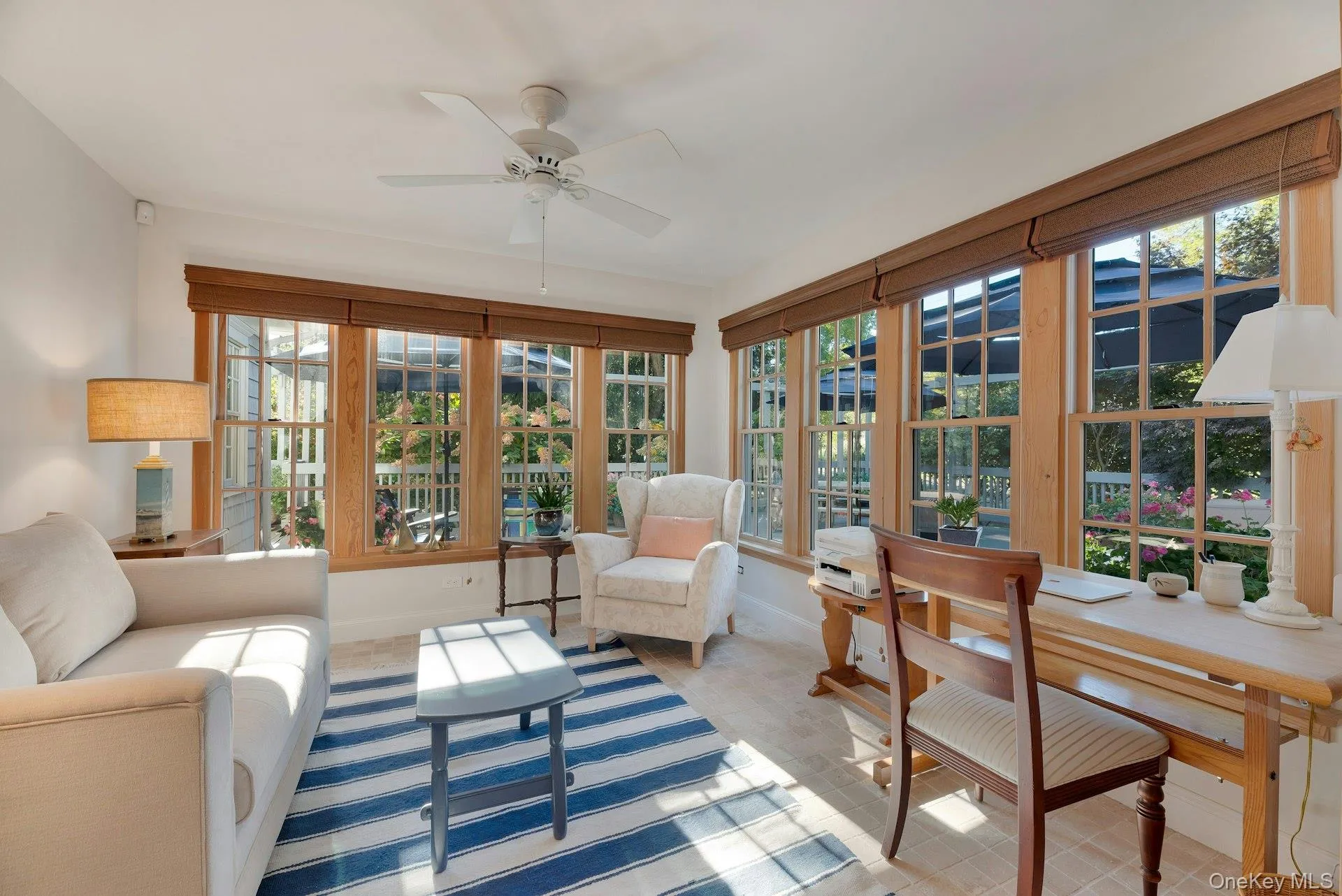 Sunroom featuring french doors and healthy amount of natural light Sunroom featuring french doors and healthy amount of natural light
