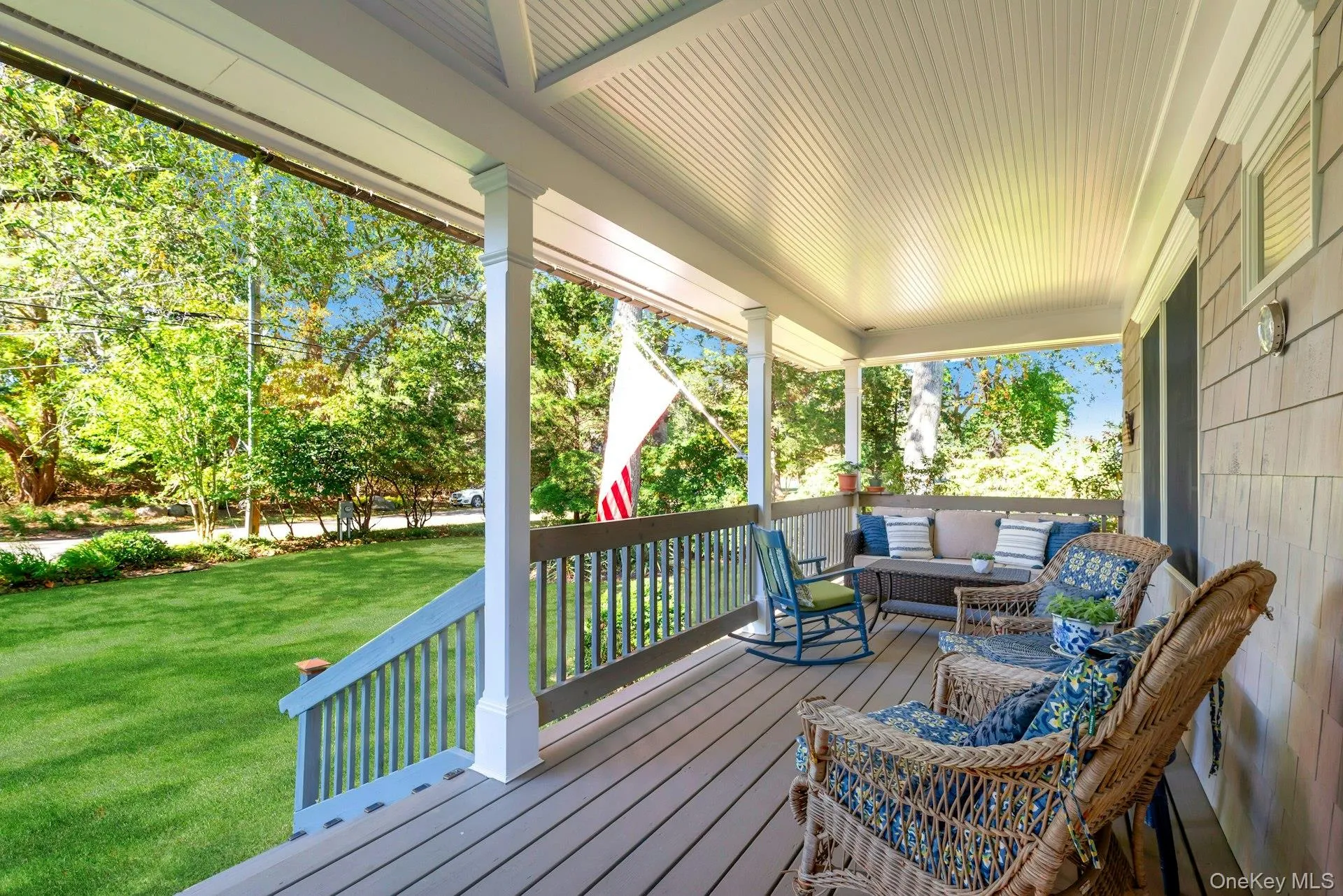 Wooden porch with a yard and outdoor lounge area Wooden porch with a yard and outdoor lounge area