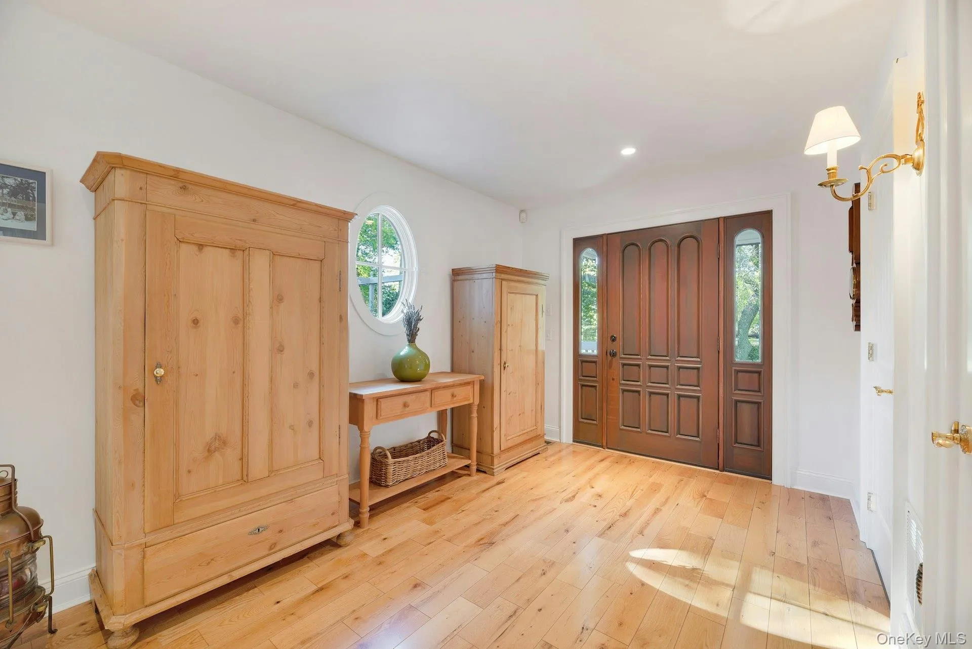 Entrance foyer with hardwood / wood-style flooring and recessed lighting Entrance foyer with hardwood / wood-style flooring and recessed lighting