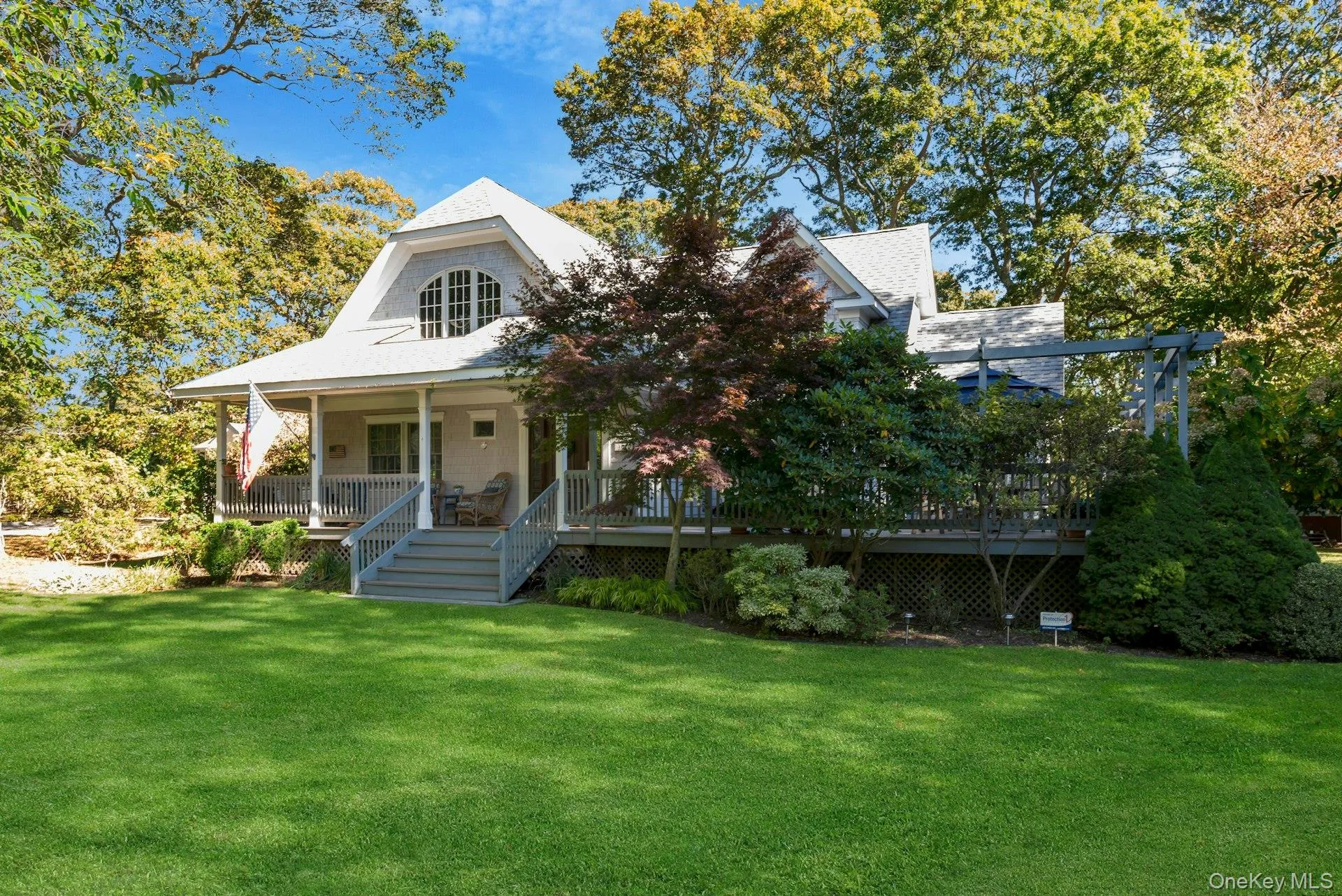 View of front of home with a front yard and a porch View of front of home with a front yard and a porch