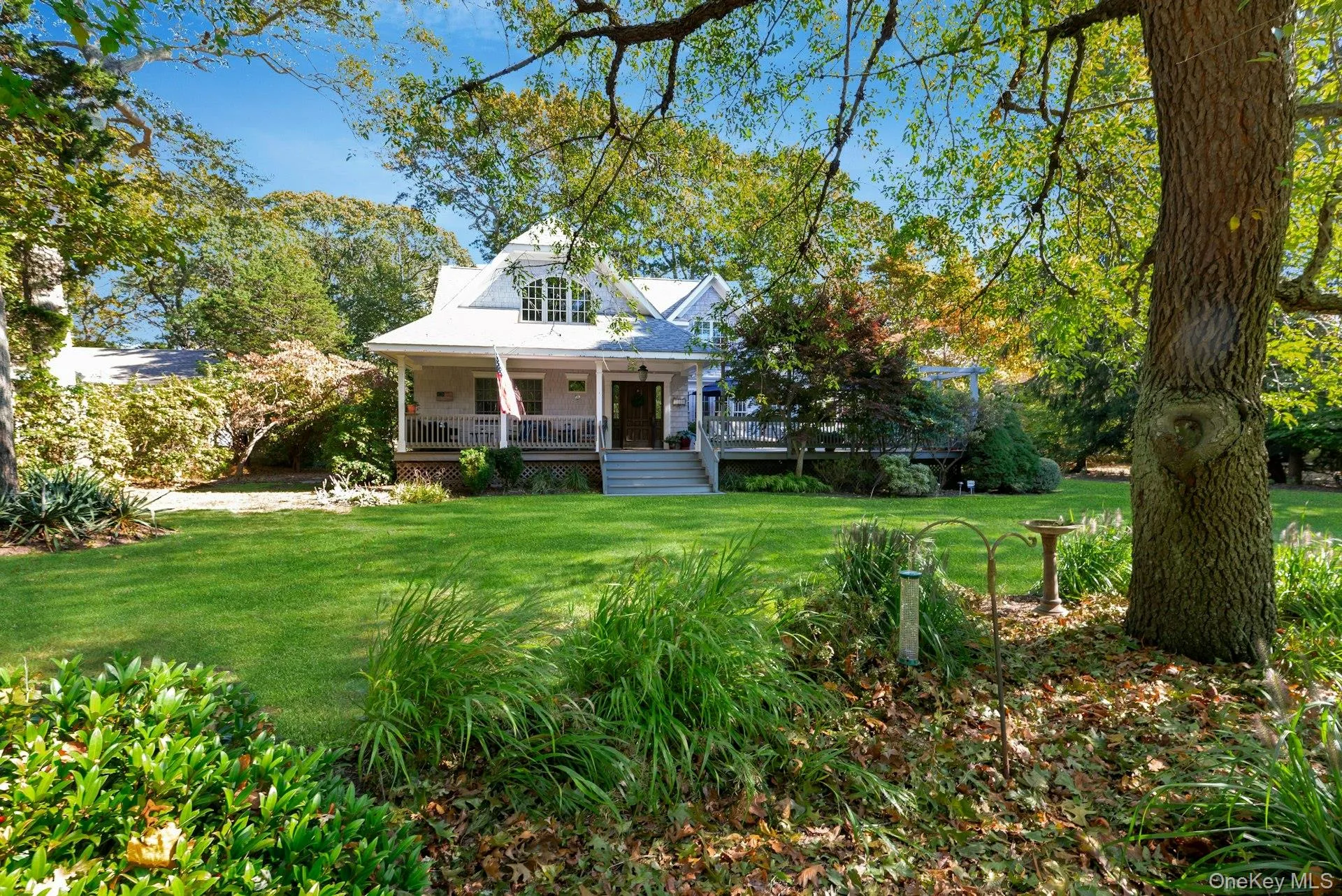 View of front of home with a porch and a front yard View of front of home with a porch and a front yard