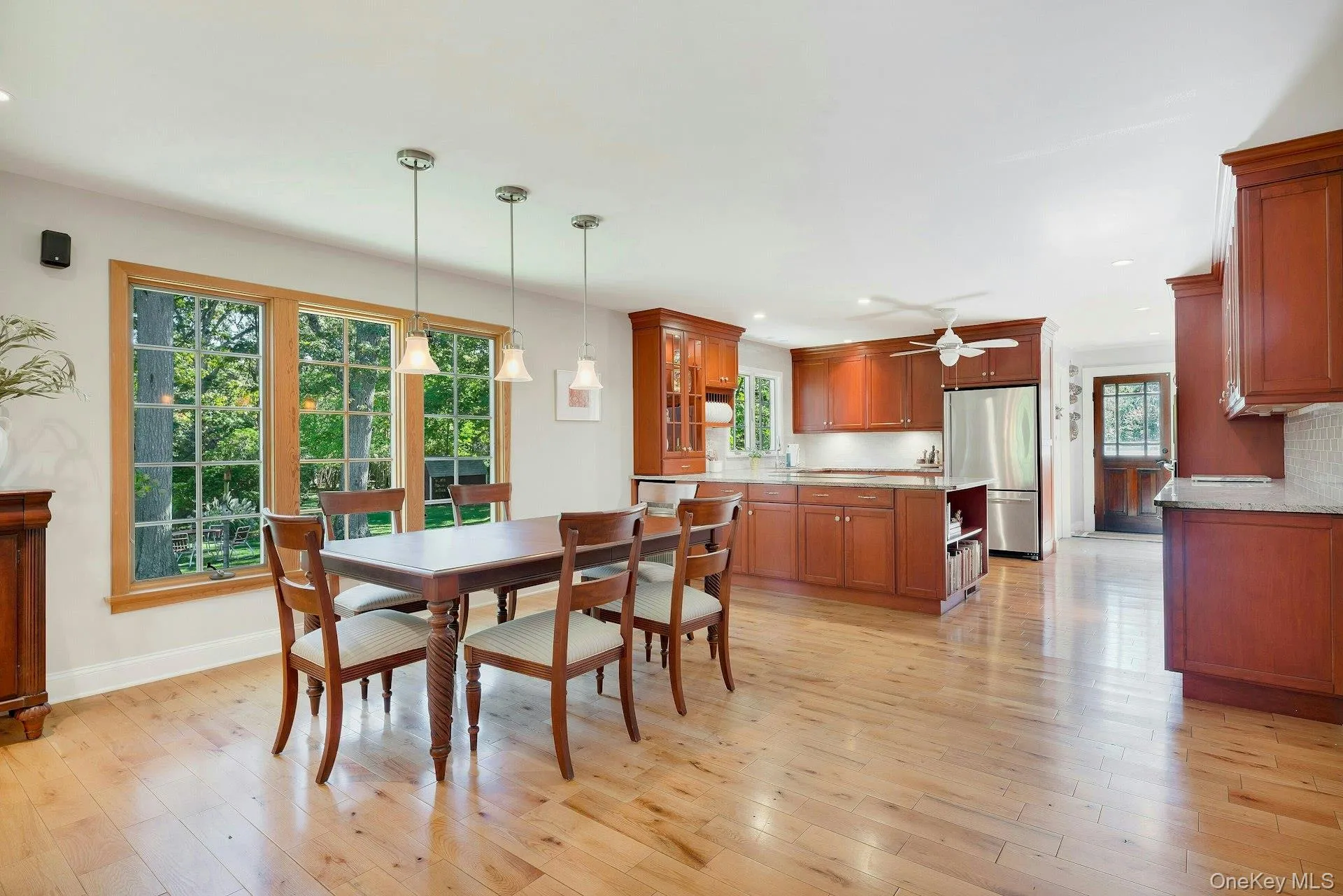 Dining room with plenty of natural light, recessed lighting, light wood-style floors, and a ceiling fan Dining room with plenty of natural light, recessed lighting, light wood-style floors, and a ceiling fan